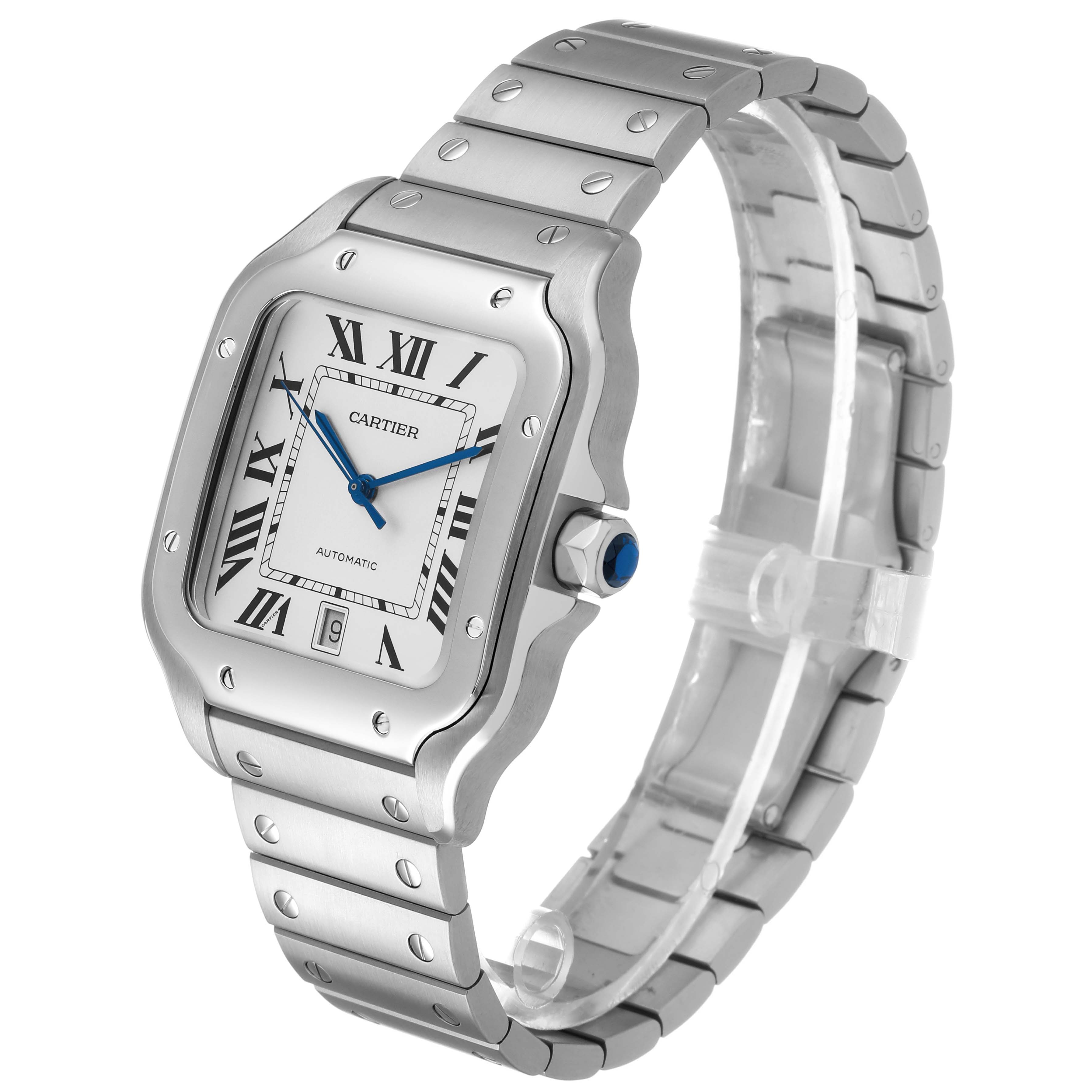 The Cartier Santos WSSA0009 Men's Stainless Steel Silver Dial watch is shown from a three-quarter angle, displaying the face, crown, and bracelet with Roman numerals and blue hands.
