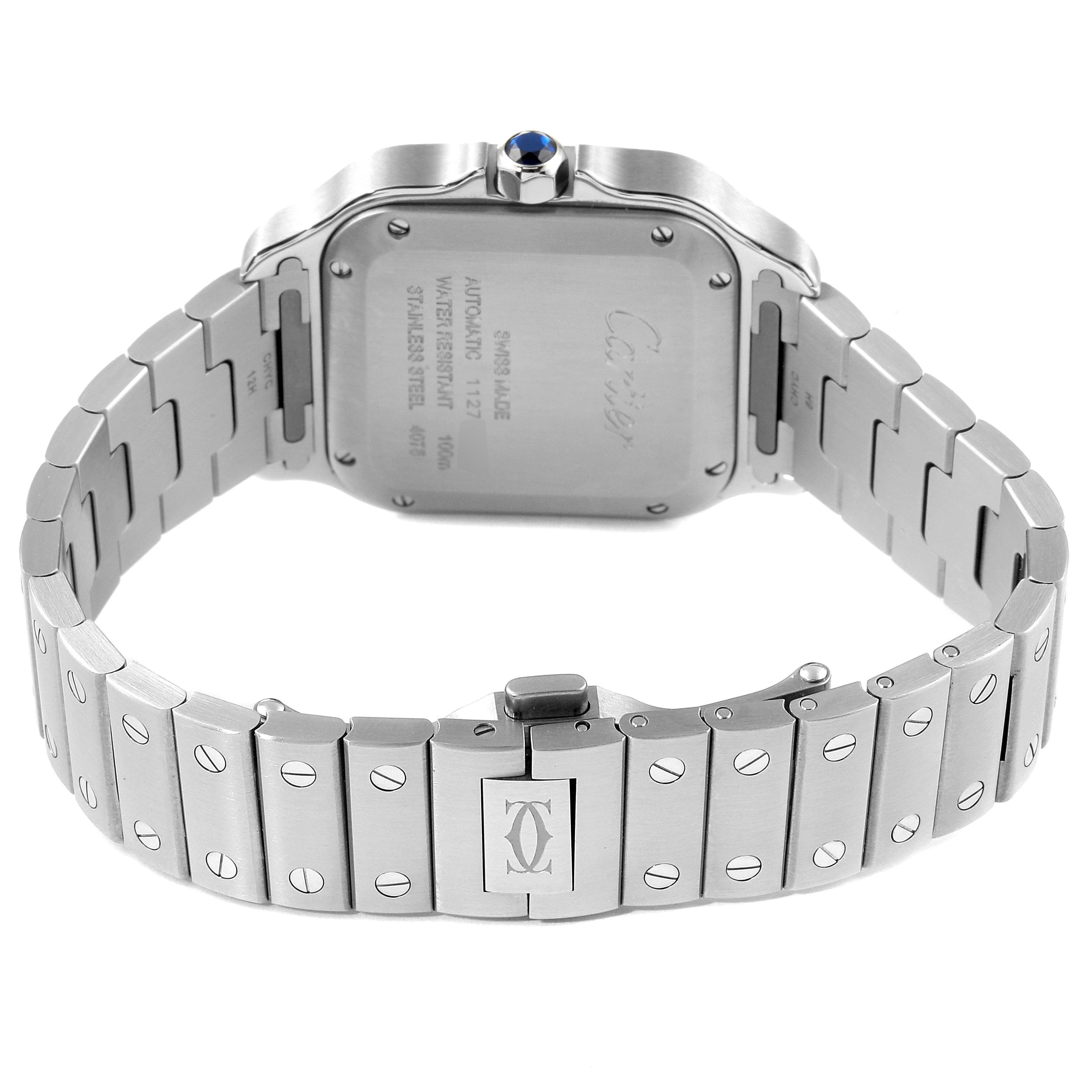 The image shows the back view of a Santos model by Cartier, highlighting the case back, bracelet, and clasp.