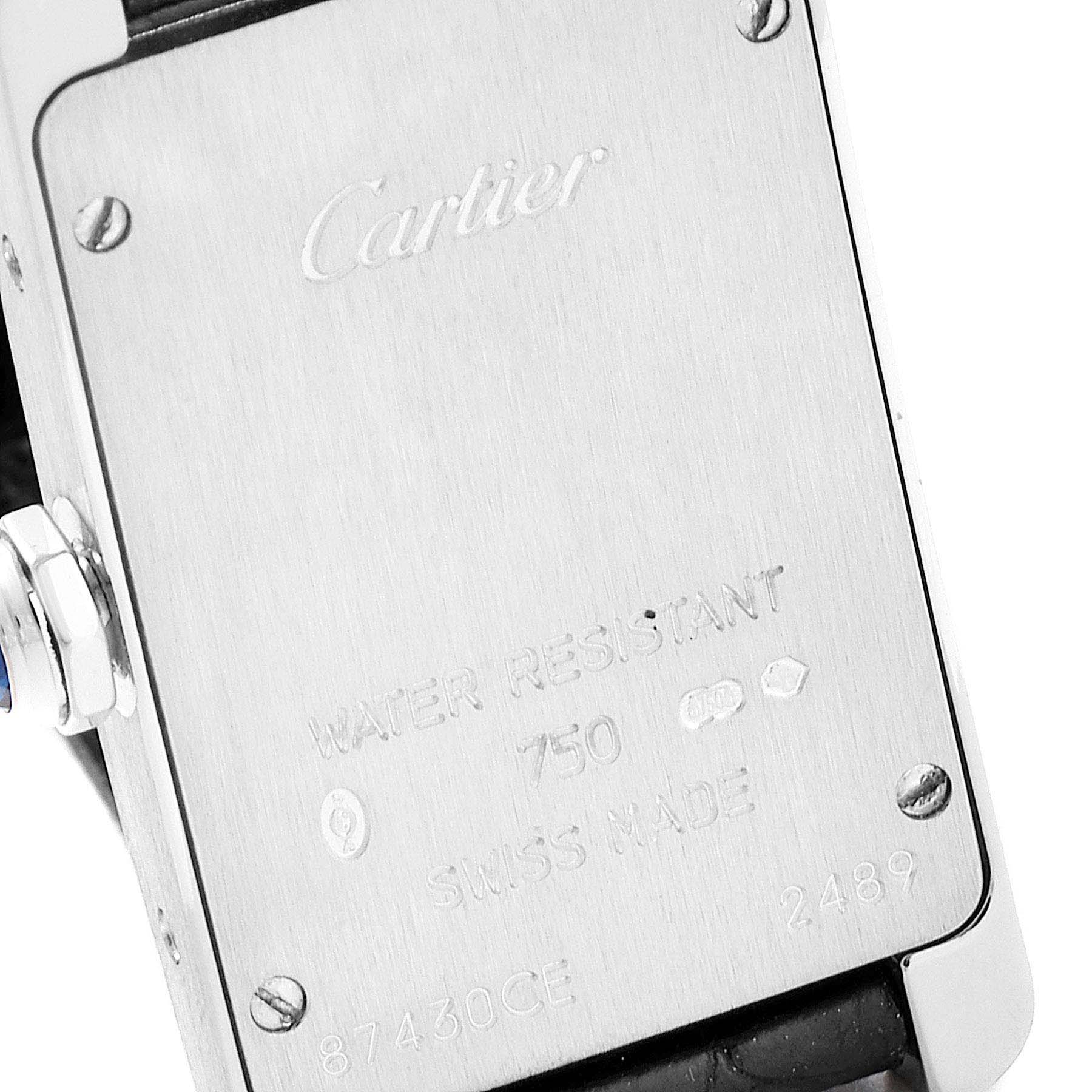 This image shows the back case of the Cartier Tank Americaine W2601956 Women's White Gold Silver Dial W2601956 Women's White Gold Silver Dial watch, highlighting engravings and screws.