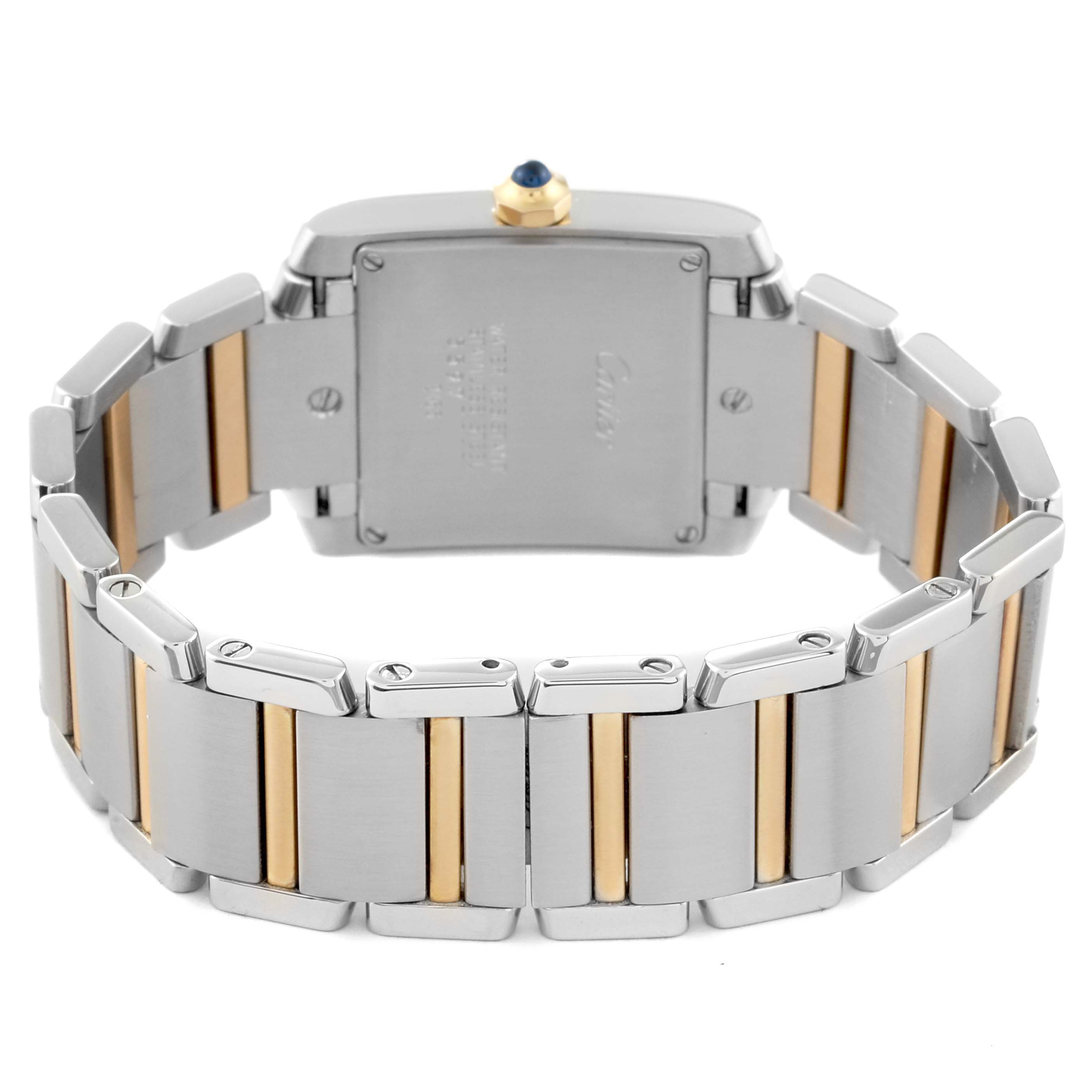 The Cartier Tank Française watch is shown from the rear, highlighting its steel and gold bracelet and the case back.