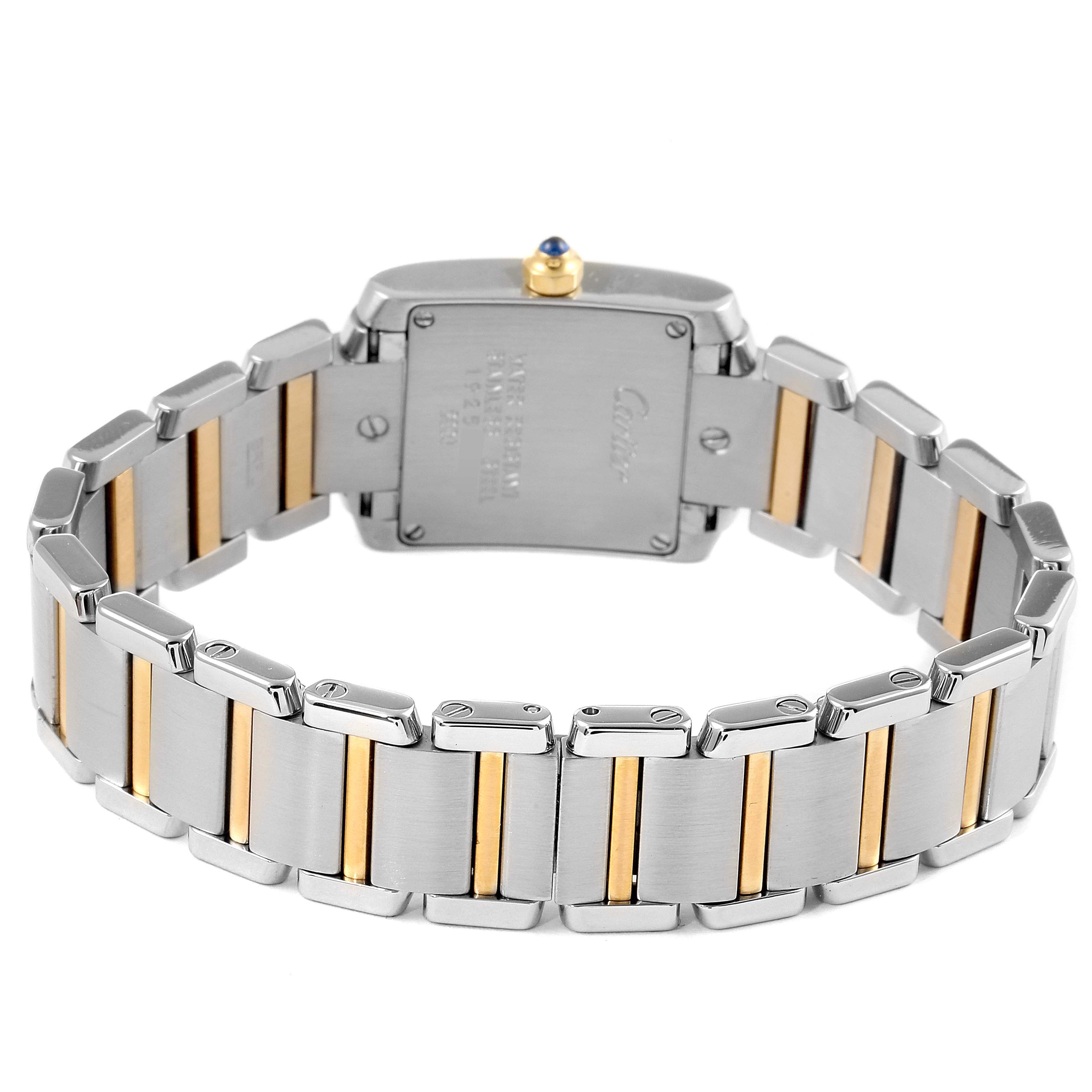 The image shows the backside of the Cartier Tank Française watch, highlighting its metal bracelet with gold accents.