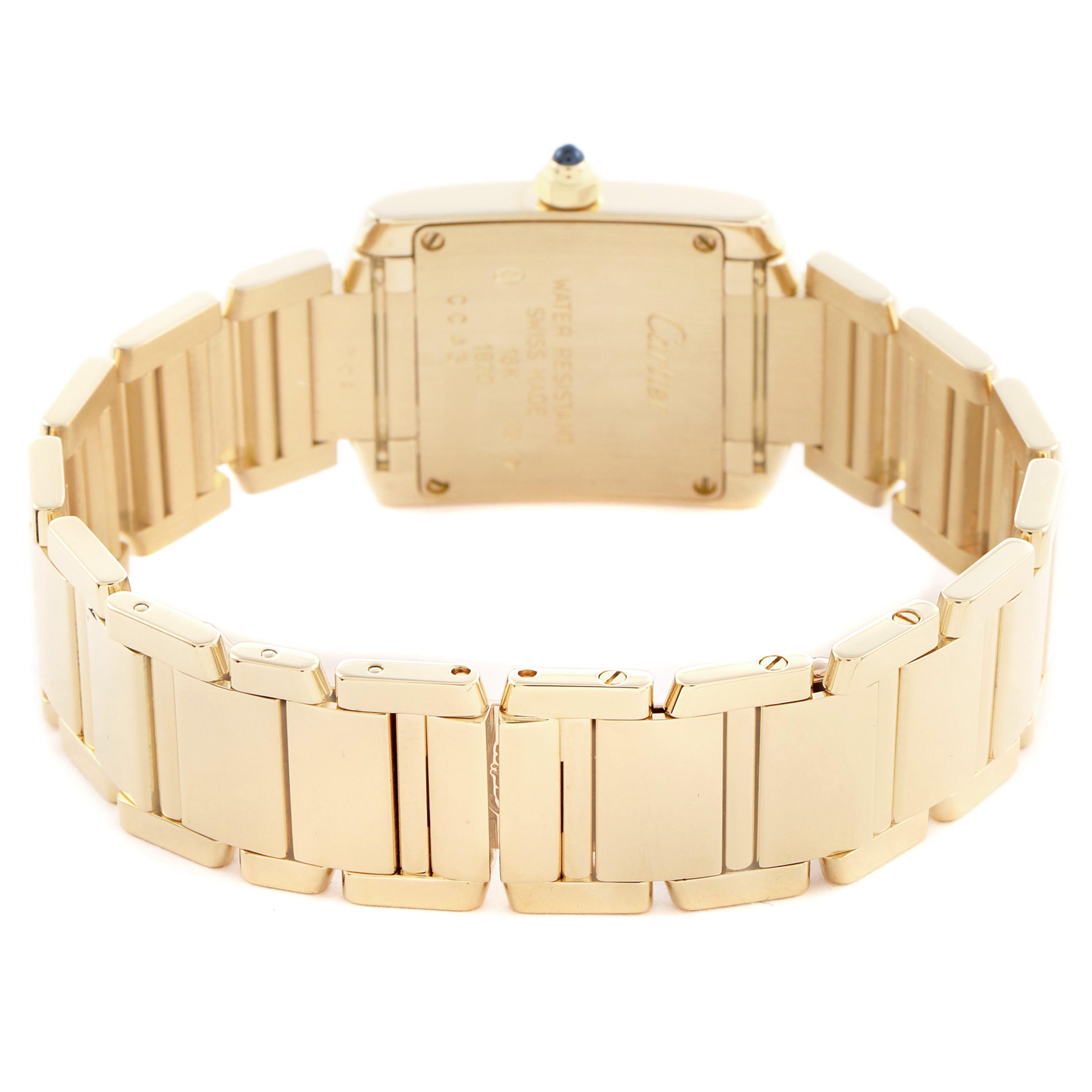 The image shows the back of the Cartier Tank Francaise W50002N2 Women
s Yellow Gold Silver Dial W50002N2 Women
s Yellow Gold Silver Dial watch, highlighting the bracelet and case back at a slightly elevated angle.