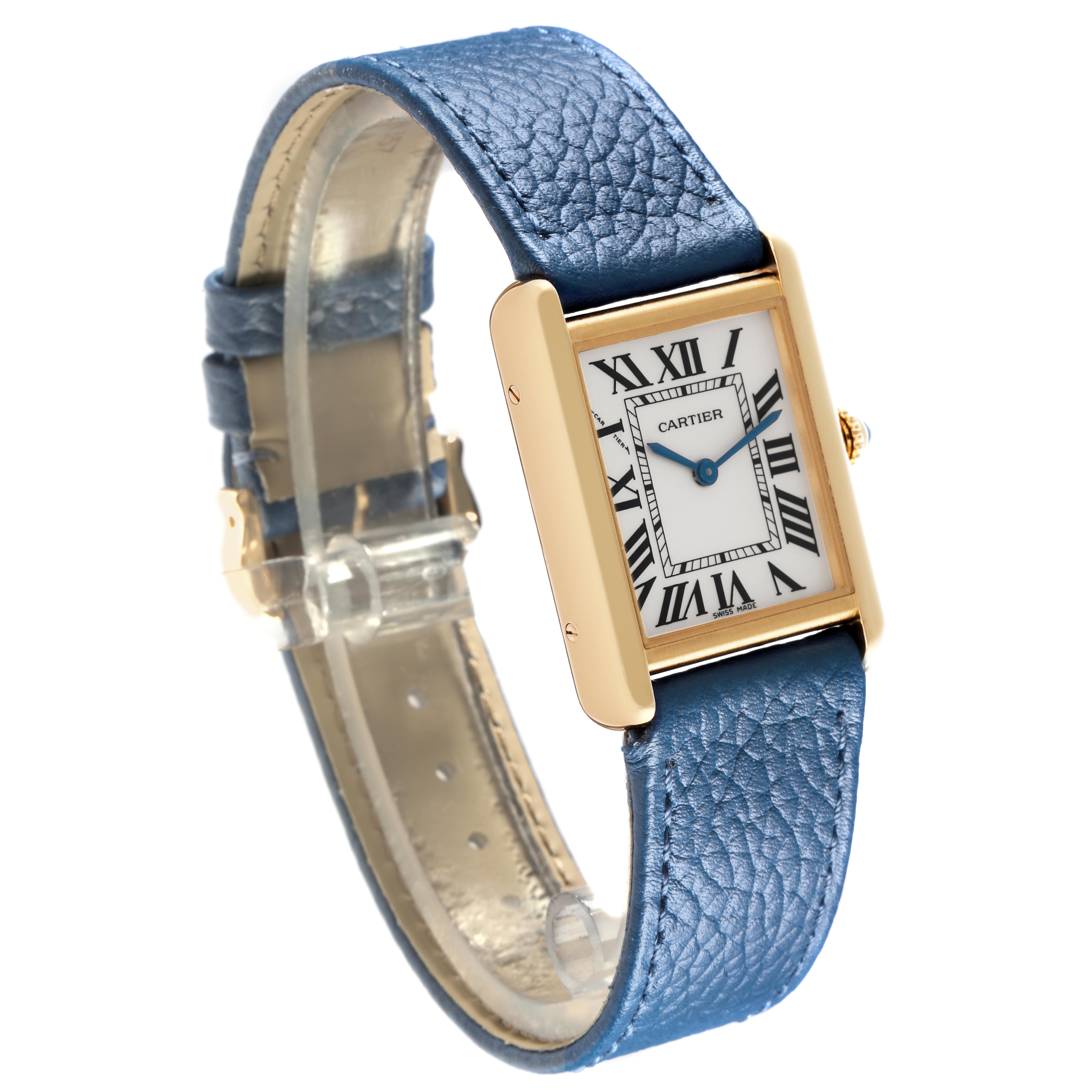 The Cartier Tank Solo W5200002 Women
s Steel and Gold (two tone) Silver Dial W5200002 Women
s Steel and Gold (two tone) Silver Dial watch is shown at a three-quarter angle, highlighting its gold case, blue leather strap, and Roman numeral dial.