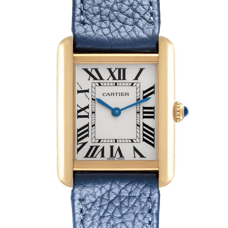 The Cartier Tank Solo watch is shown from the front, featuring its rectangular face, roman numerals, blue hands, and leather strap.