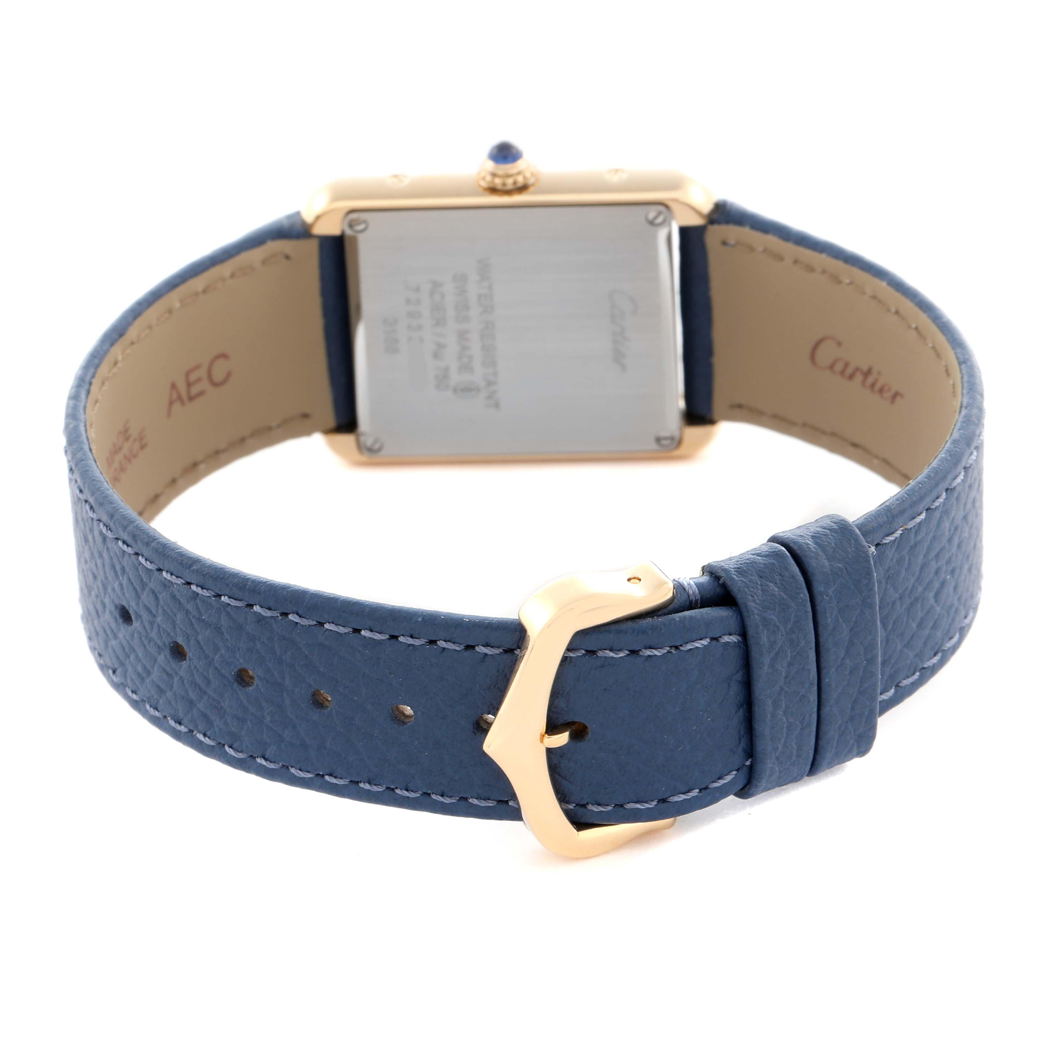 The Cartier Tank Solo W5200002 Women
s Steel and Gold (two tone) Silver Dial W5200002 Women
s Steel and Gold (two tone) Silver Dial watch is shown from the back, highlighting the case back, blue leather strap, and gold buckle.