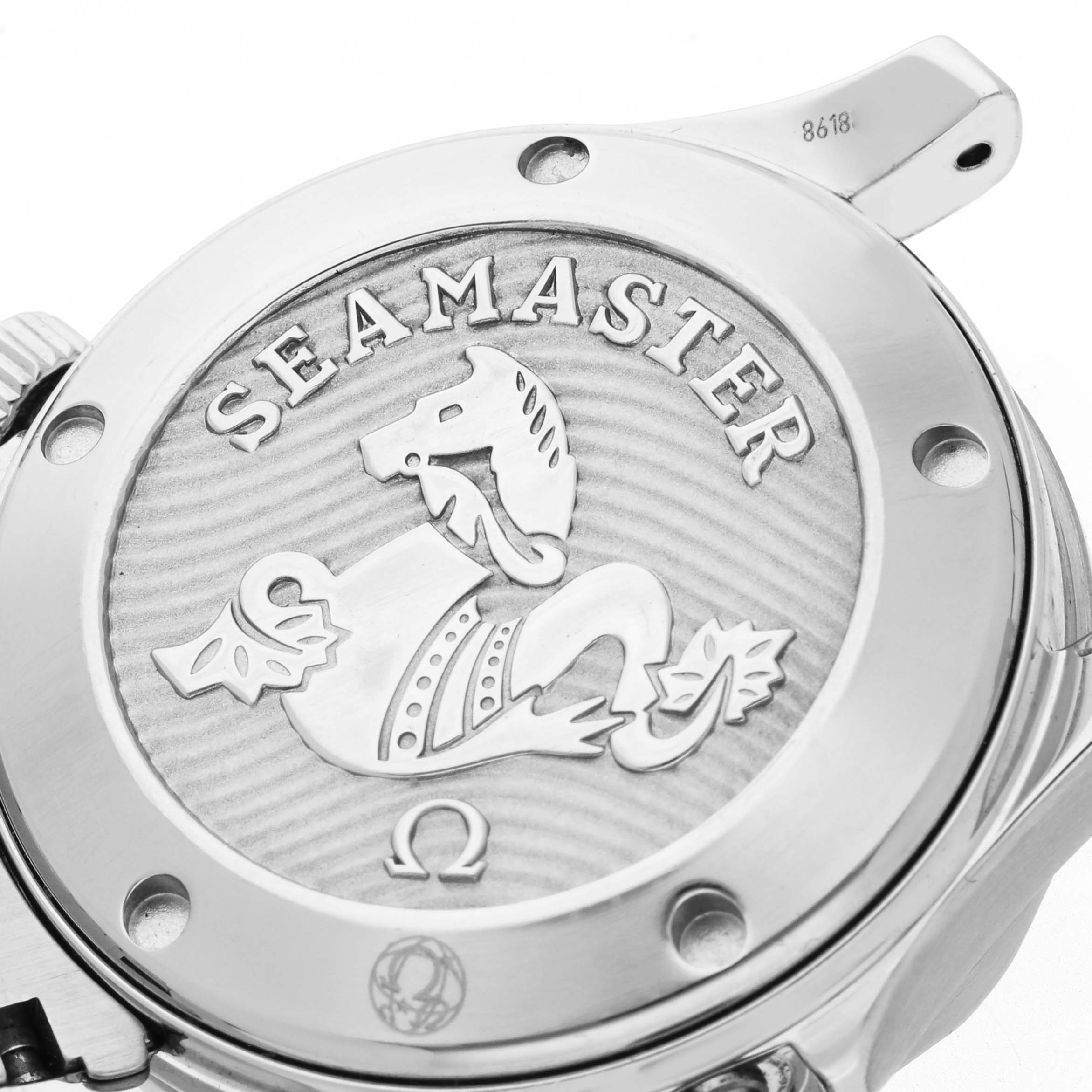 The image shows the back of the Omega Seamaster 212.30.36.20.01.002 Men
s Stainless Steel Black Dial 212.30.36.20.01.002 Men
s Stainless Steel Black Dial watch, featuring its engraved emblem and branding details.