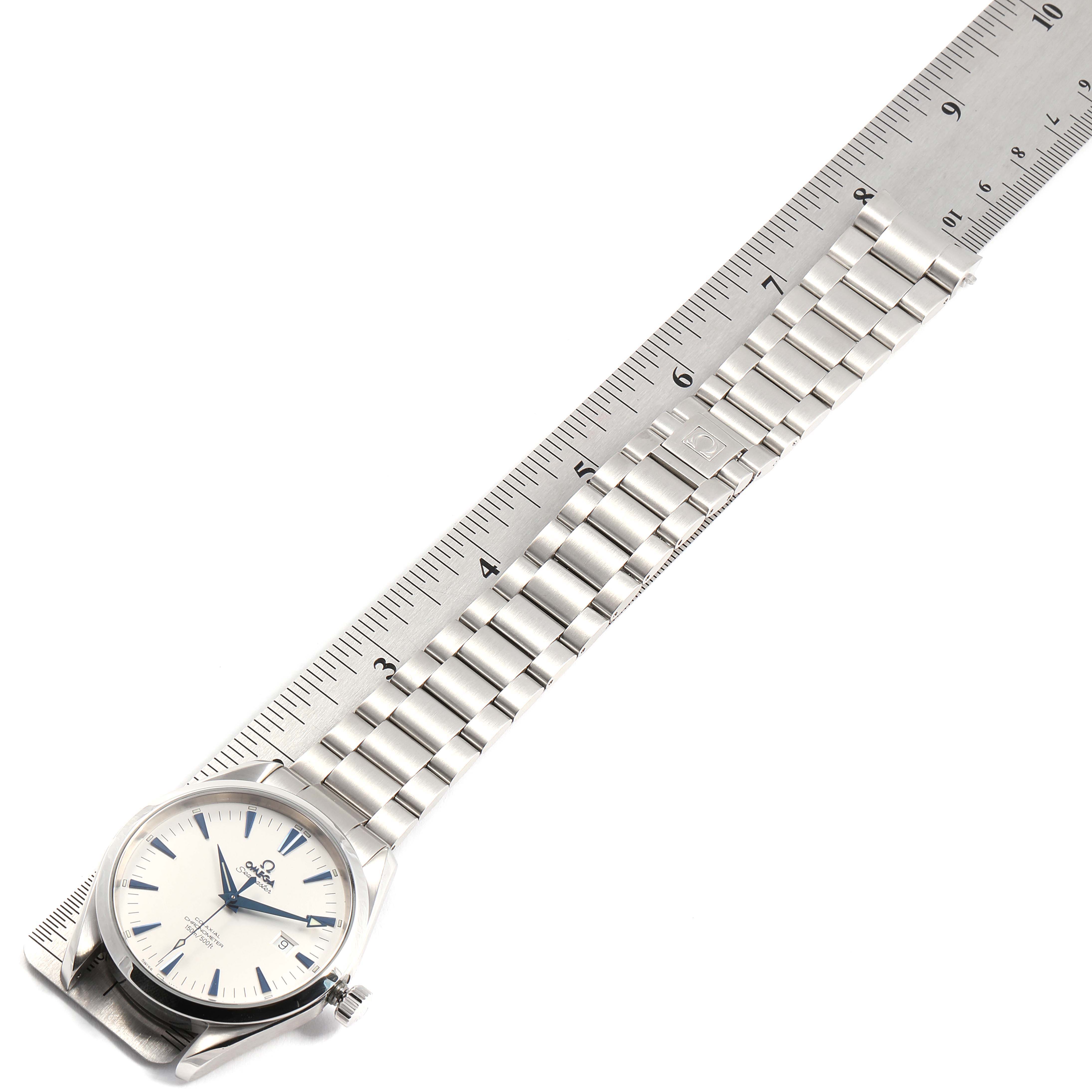 This image shows an Omega Aqua Terra 2502.33.00 Men's Stainless Steel White Dial 2502.33.00 Men's Stainless Steel White Dial watch laid flat next to a ruler, highlighting its full bracelet and face.