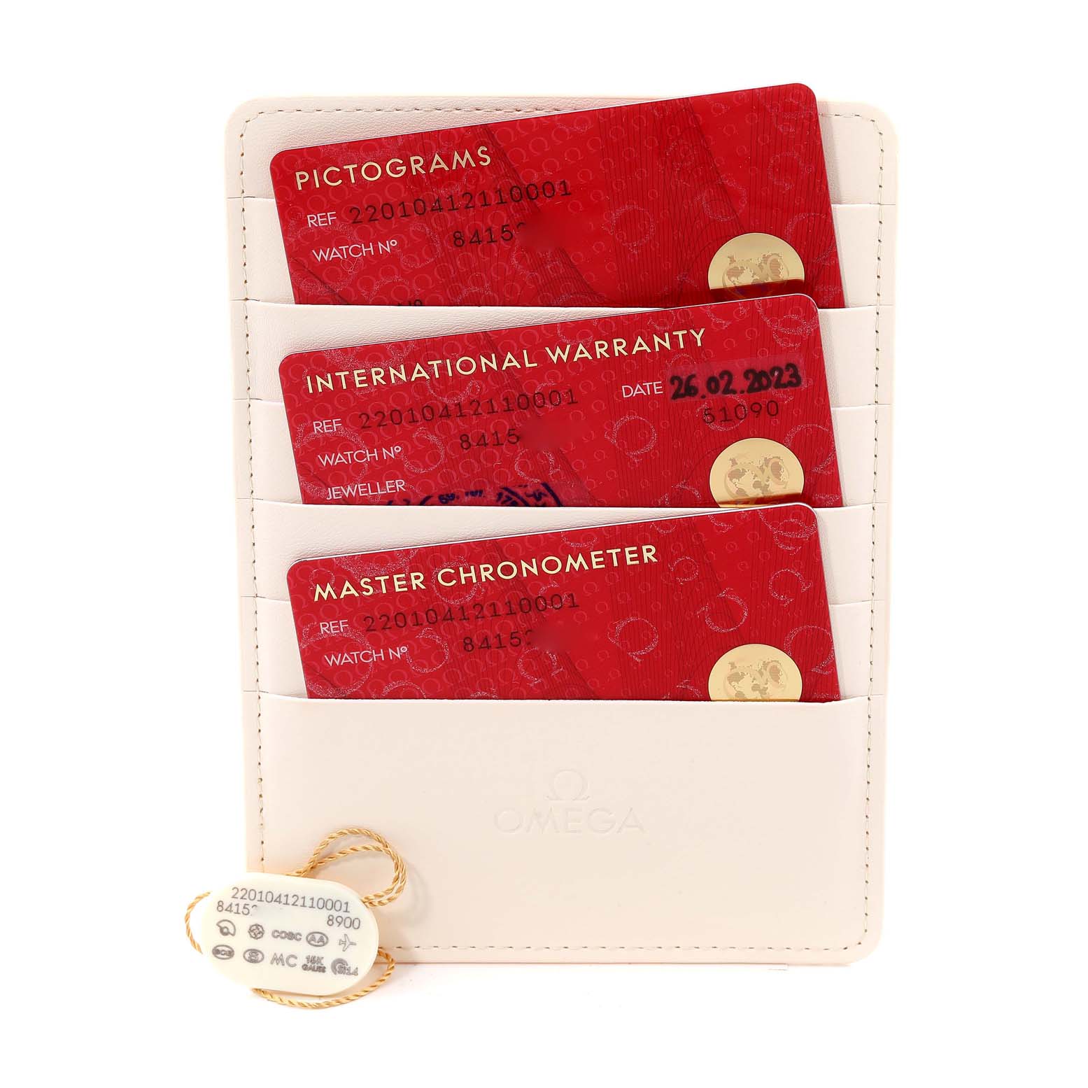 The image shows warranty and certification cards for the Omega Aqua Terra 220.10.41.21.10.001 Men's Stainless Steel Green Dial 220.10.41.21.10.001 Men's Stainless Steel Green Dial watch, held in a cardholder along with a tag.