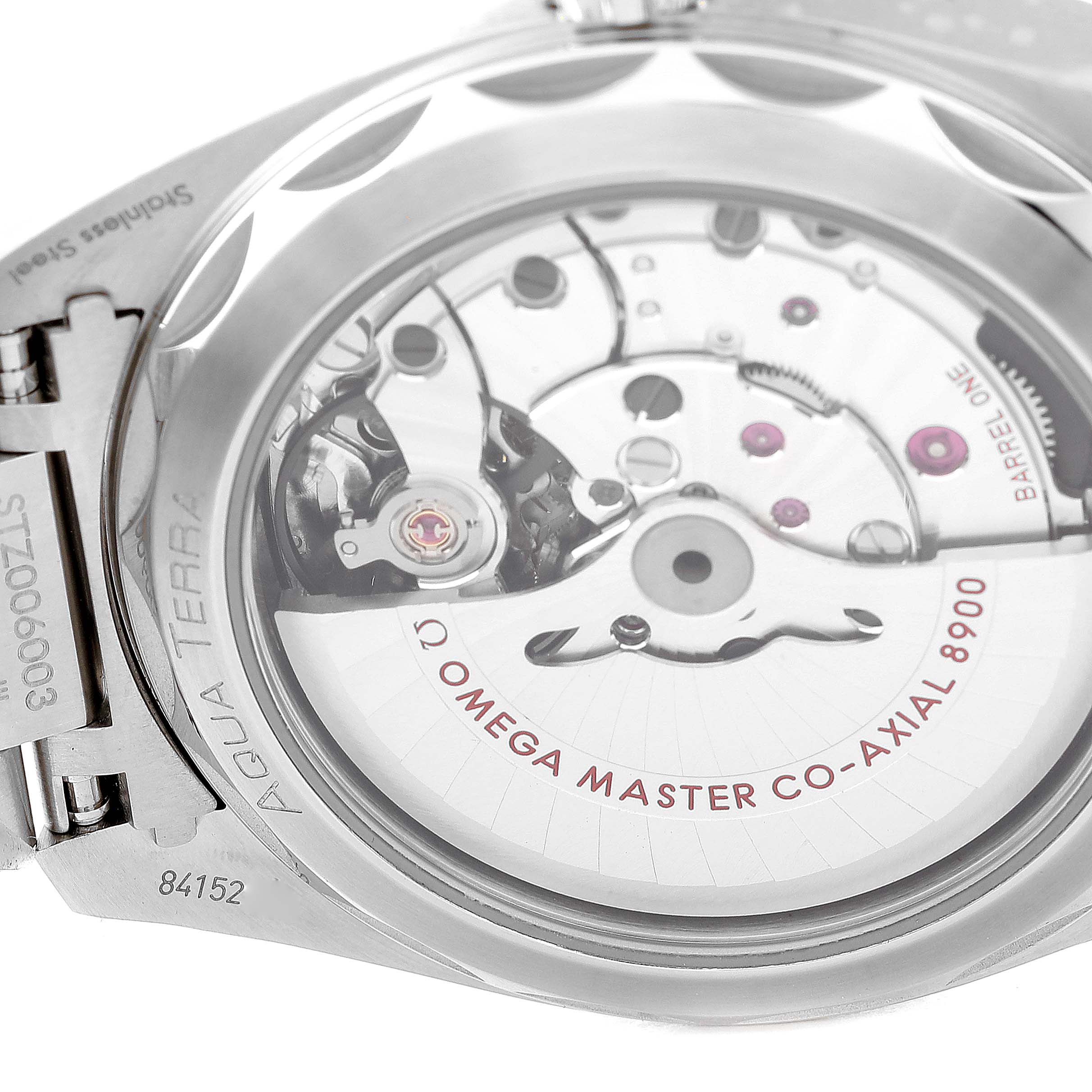 This image shows the back view of the Omega Aqua Terra 220.10.41.21.10.001 Men's Stainless Steel Green Dial 220.10.41.21.10.001 Men's Stainless Steel Green Dial watch, focusing on its exposed internal mechanism and inscriptions.