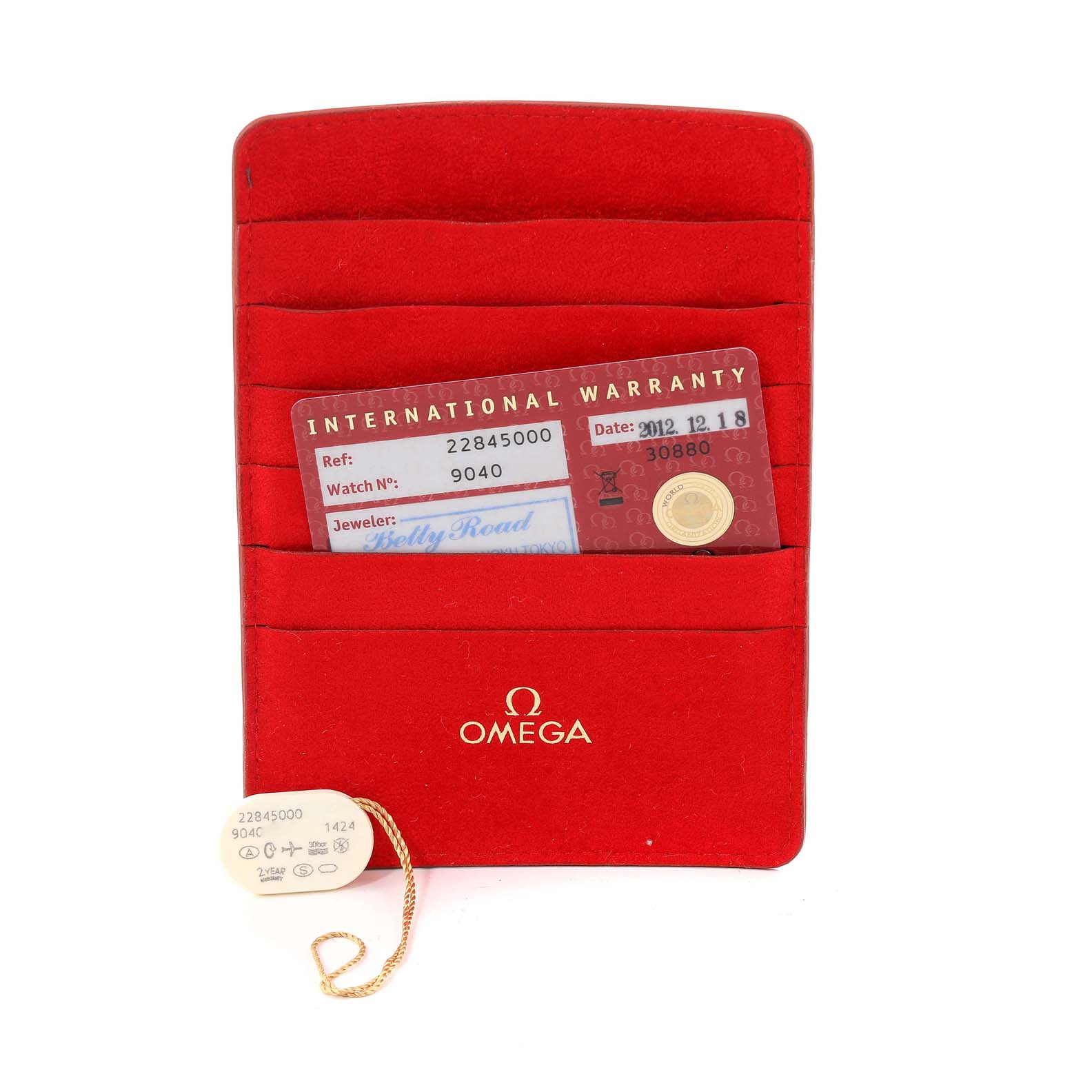 This image shows the International Warranty card and tag for the Omega 2284.50.00 Women's Stainless Steel Black Dial 2284.50.00 Women's Stainless Steel Black Dial Seamaster Diver 300M 28mm Steel Ladies Watch 2284.50.00 model.