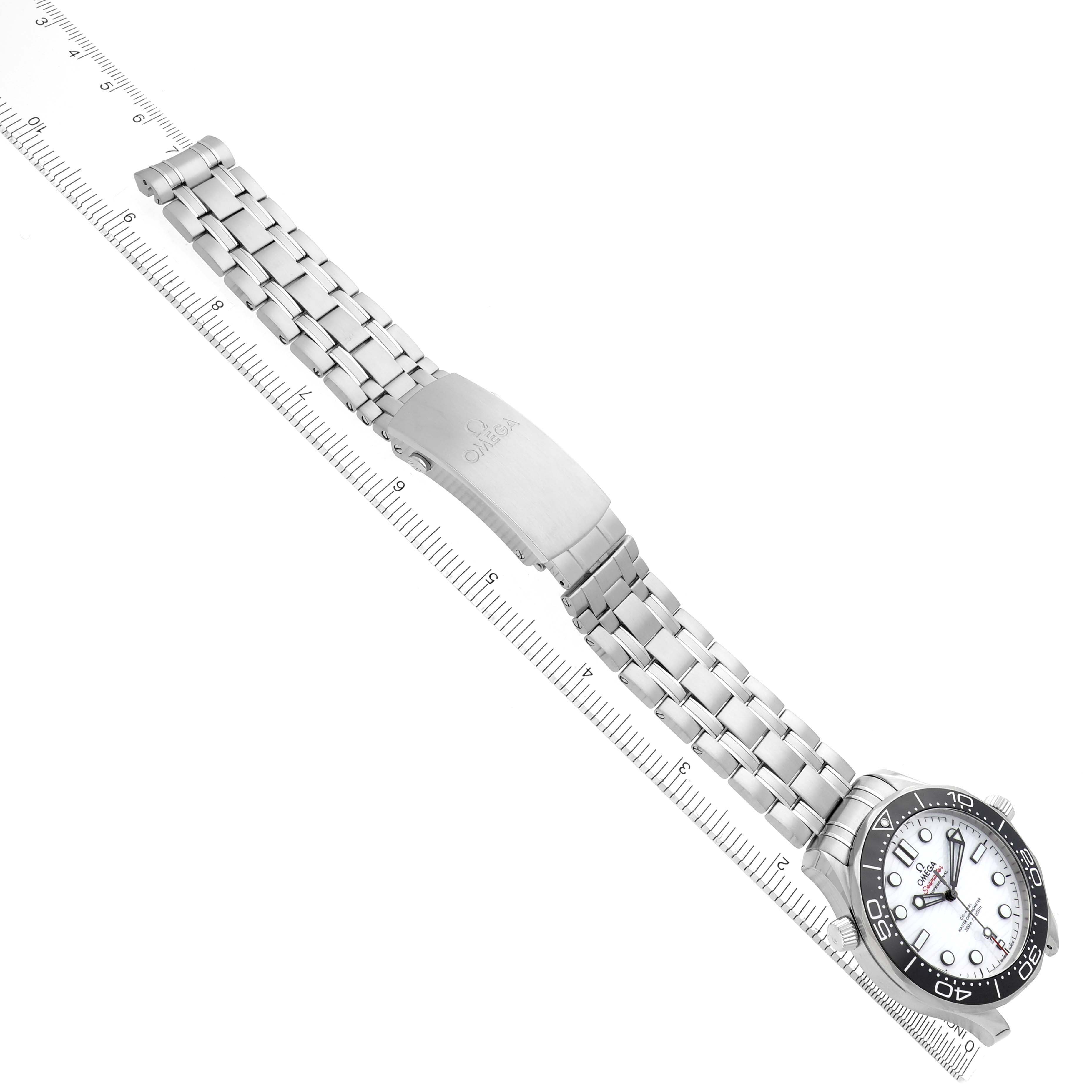The Omega Seamaster 210.30.42.20.04.001 Men
s Stainless Steel White Dial 210.30.42.20.04.001 Men
s Stainless Steel White Dial watch is shown diagonally, displaying its bracelet, clasp, and face, with a ruler alongside for scale.