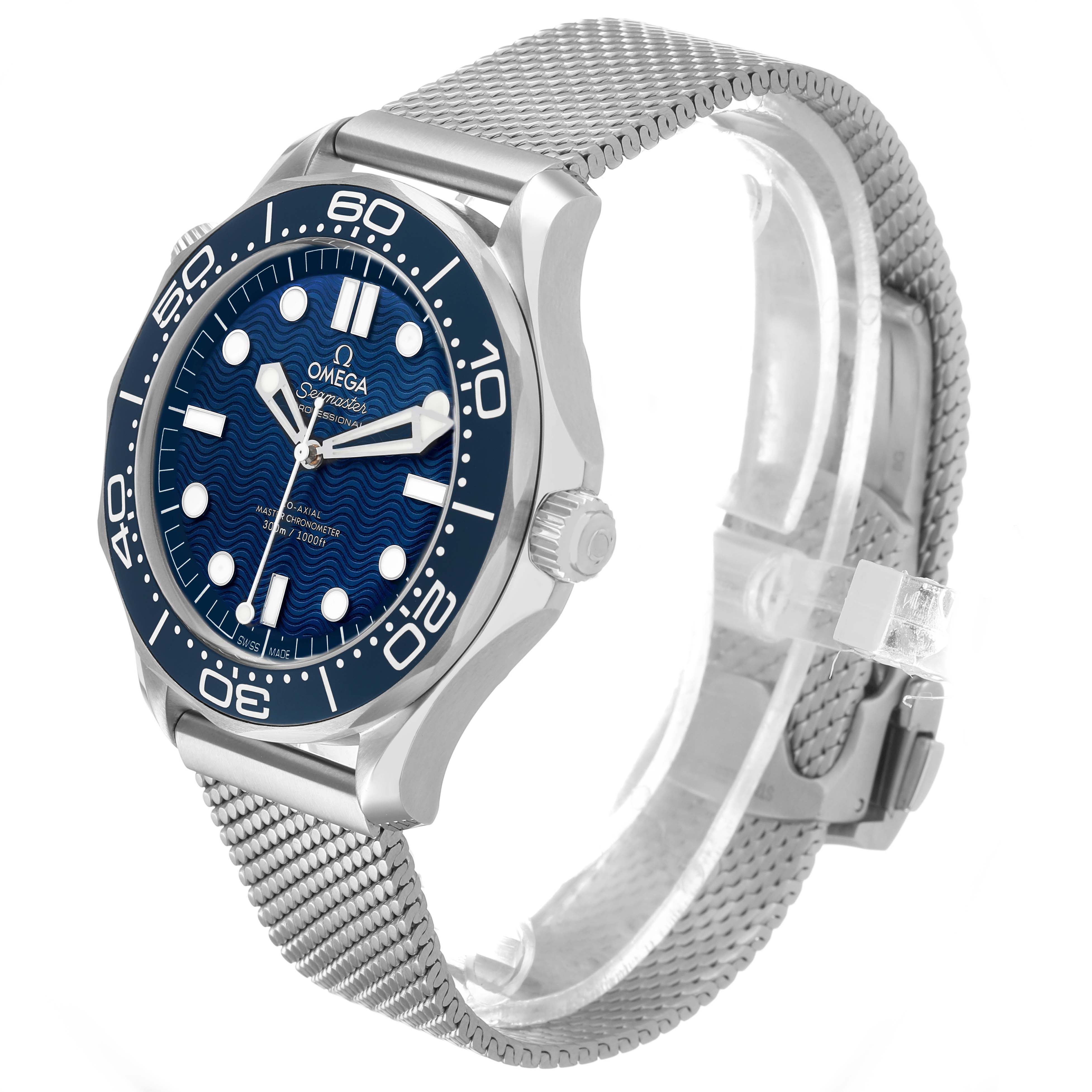 The Omega Seamaster 210.30.42.20.03.002 Men's Stainless Steel Blue Dial watch is shown at an oblique angle highlighting the face, bezel, crown, and mesh bracelet.