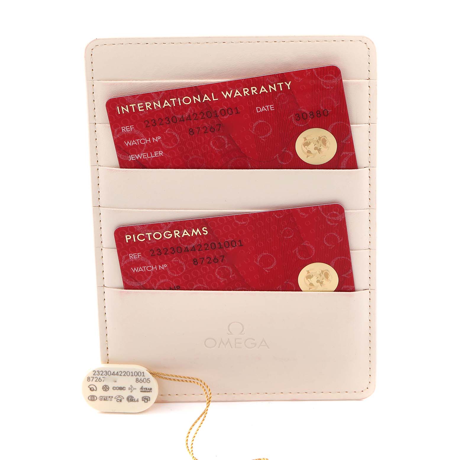 The image shows the international warranty and pictograms cards for the Omega Planet Ocean 232.30.44.22.01.001 Men
s Stainless Steel Black Dial 232.30.44.22.01.001 Men
s Stainless Steel Black Dial model, along with a beige cardholder.