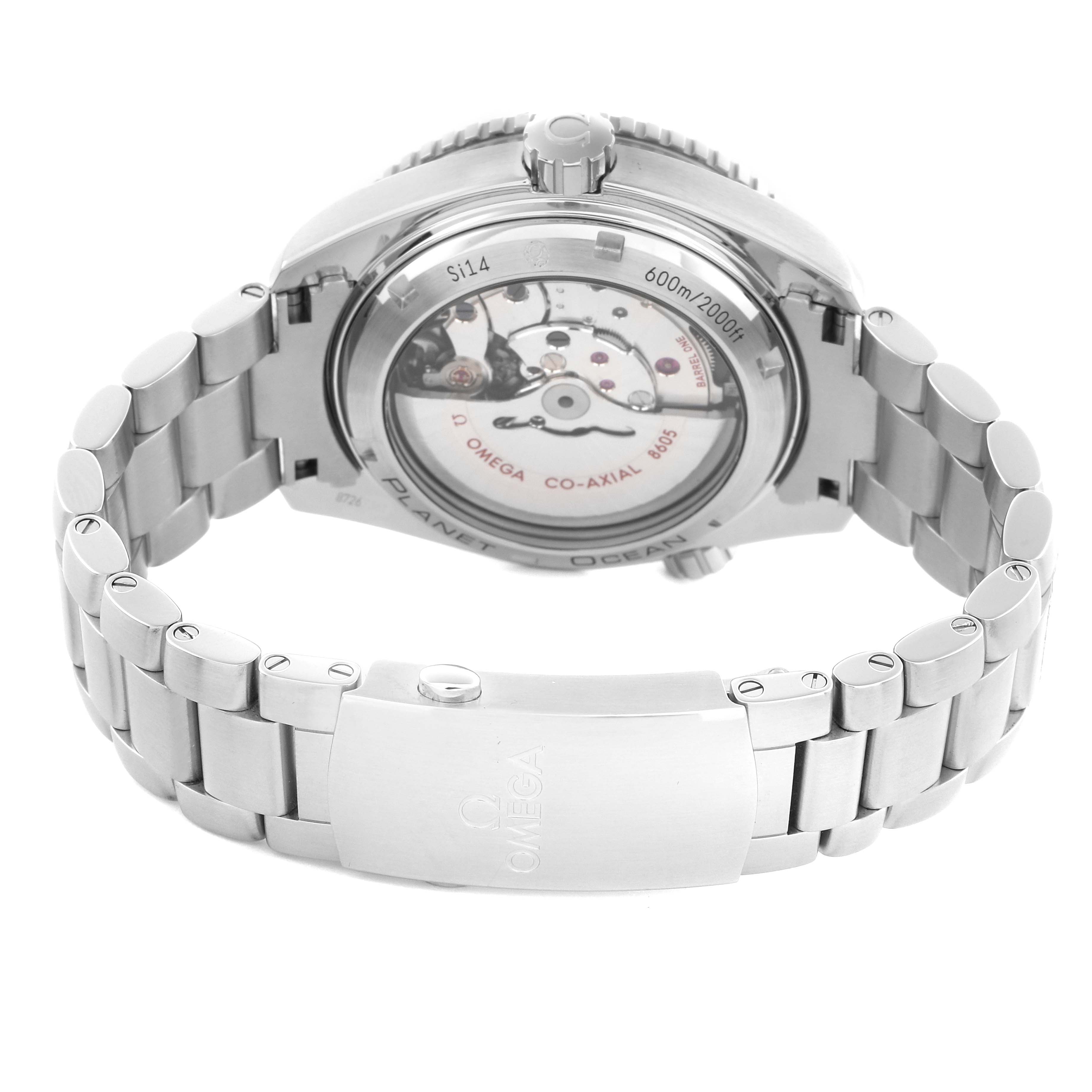 The image shows the Omega Planet Ocean 232.30.44.22.01.001 Men
s Stainless Steel Black Dial 232.30.44.22.01.001 Men
s Stainless Steel Black Dial watch from a rear angle, highlighting the open caseback and stainless steel bracelet.