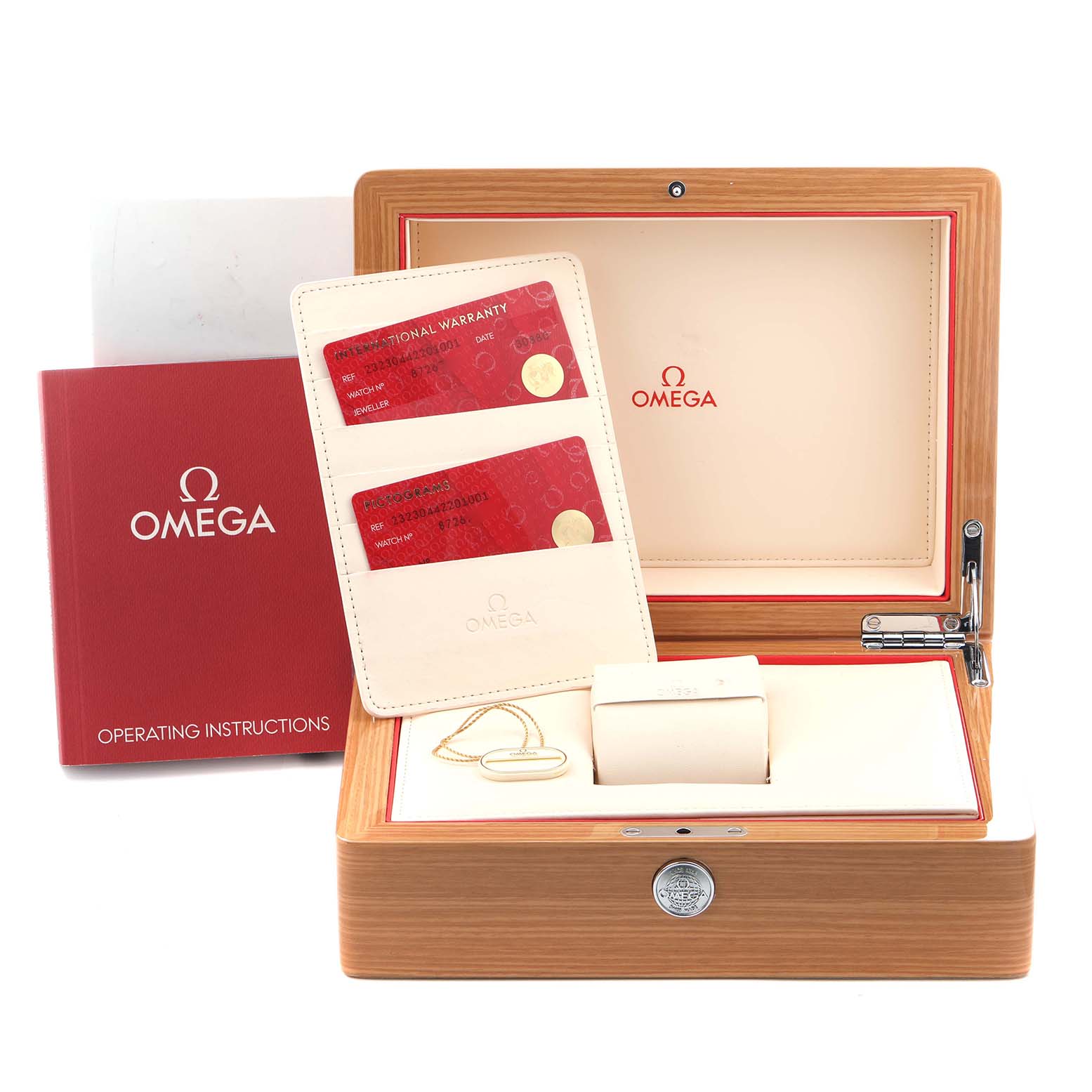 The image shows the Omega Planet Ocean 232.30.44.22.01.001 Men
s Stainless Steel Black Dial 232.30.44.22.01.001 Men
s Stainless Steel Black Dial packaging, warranty cards, and operating instructions from a front angle.