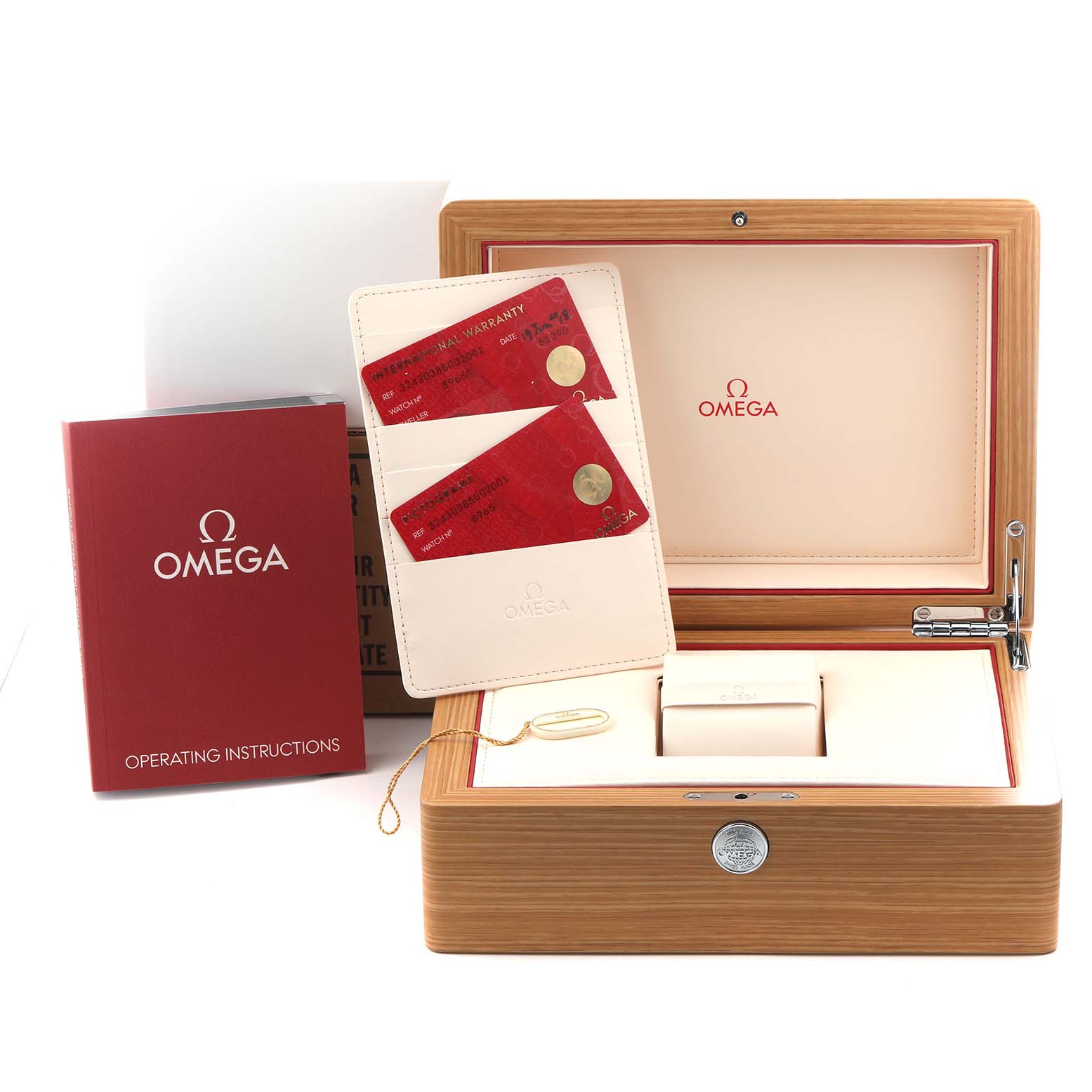 The image shows the Omega Speedmaster 324.30.38.50.02.001 Men
s Stainless Steel Silver Dial 324.30.38.50.02.001 Men
s Stainless Steel Silver Dial
s packaging including a wooden box, warranty cards in a holder, and an instruction manual.