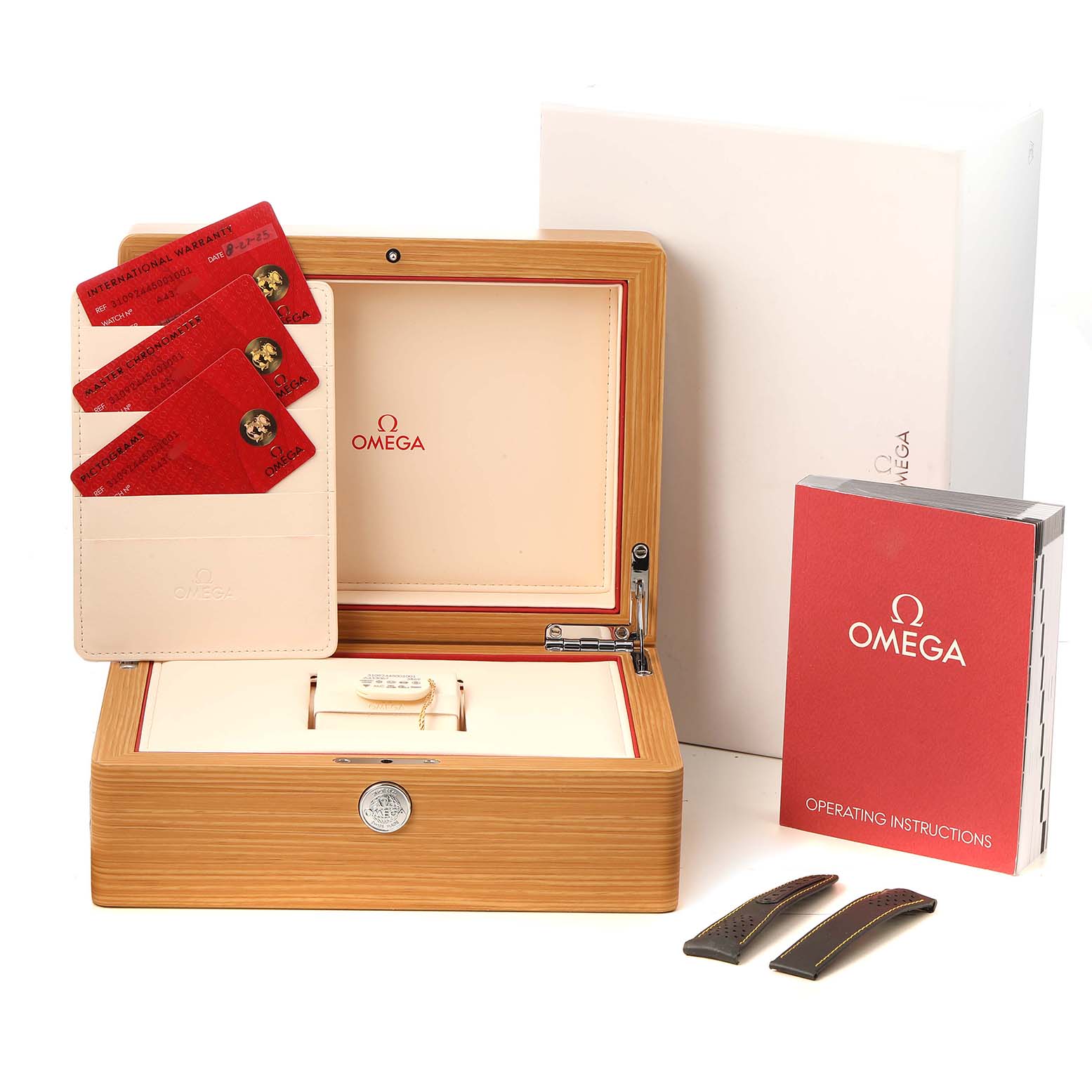 The image shows the Omega Speedmaster 310.92.44.50.01.001 Men's Ceramic Black Dial's box, warranty cards, instructions, and extra straps from a front angle.