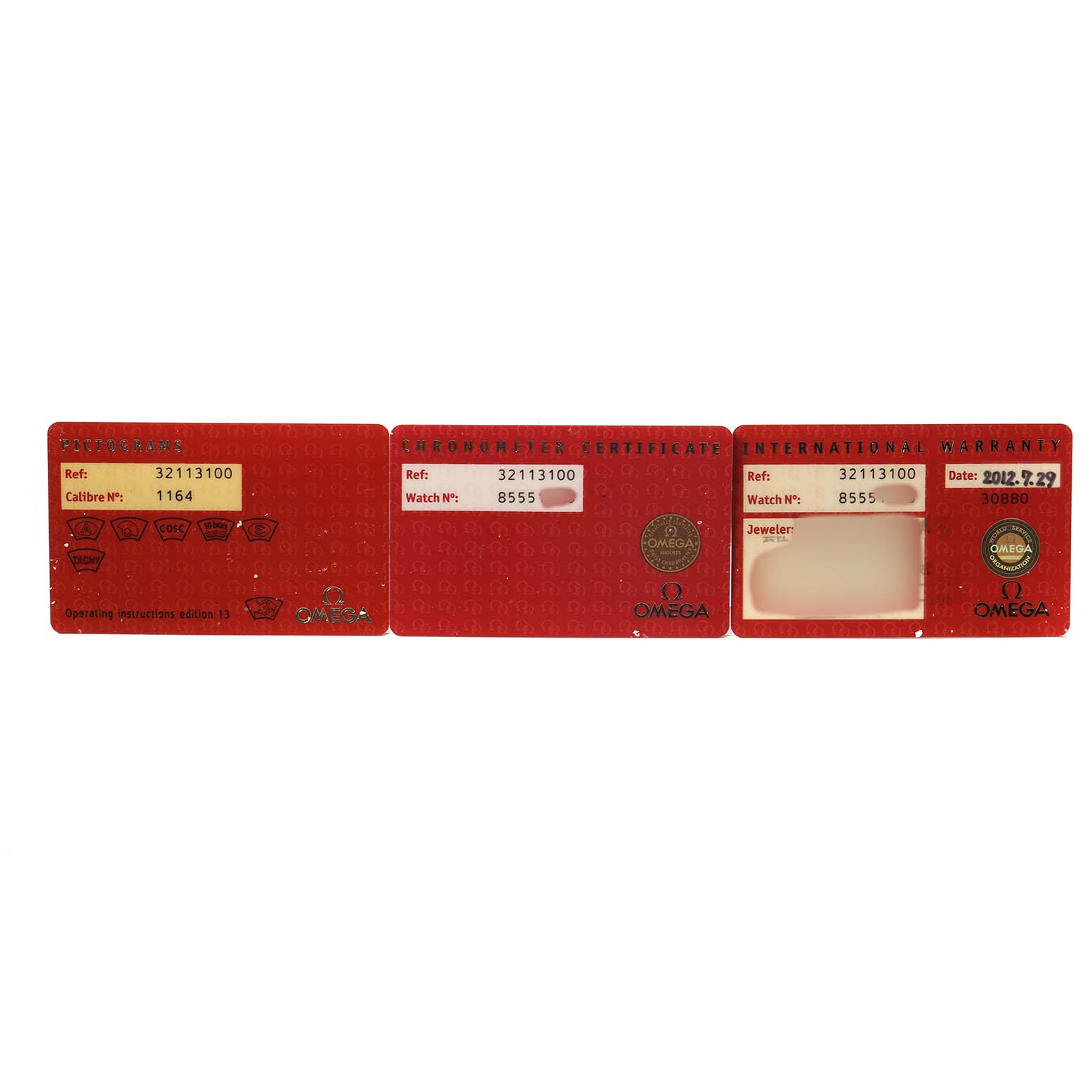 The image shows three red warranty and certification cards for the Omega Speedmaster 3211.31.00 Men's Stainless Steel Silver Dial.