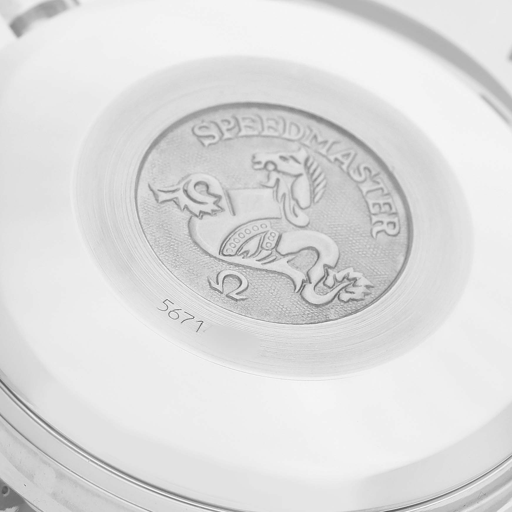 The image shows the engraved case back of an Omega Speedmaster 3513.50.00 Men's Stainless Steel Black Dial watch.