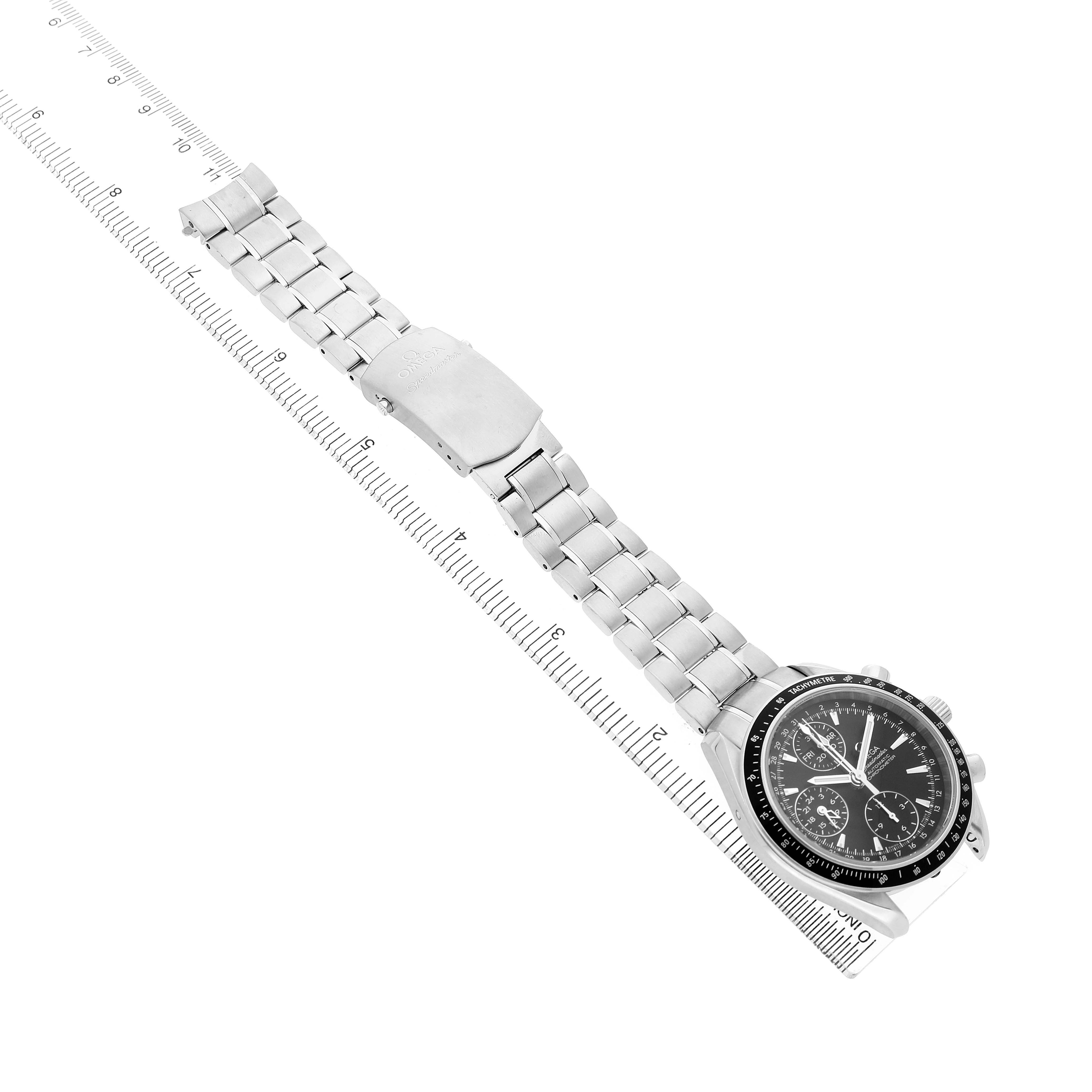 The Omega Speedmaster 3220.50.00 Men's Stainless Steel Black Dial watch is shown at a side angle, highlighting its bracelet, clasp, and chronograph dial alongside a ruler.