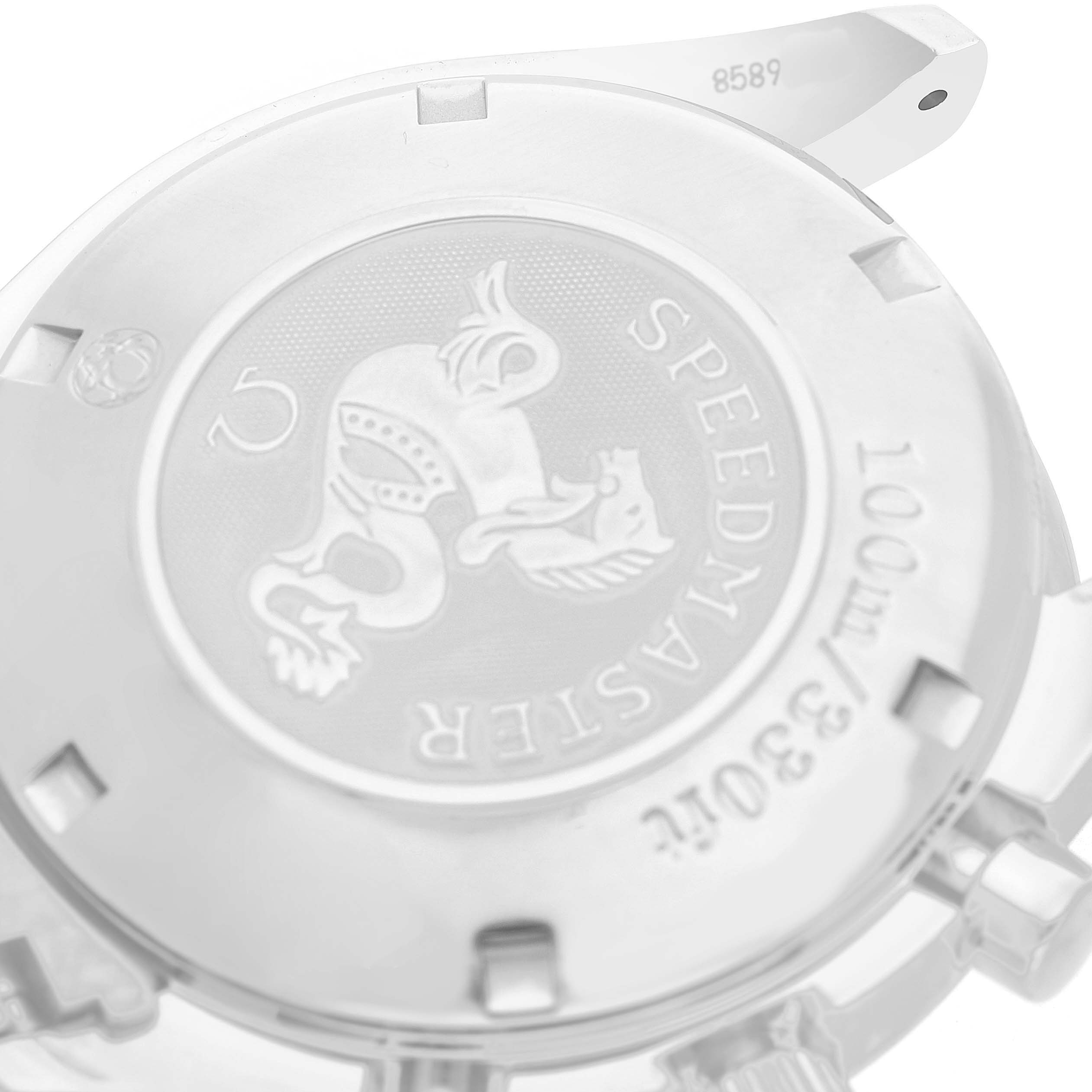 The image shows the back case of an Omega Speedmaster 3220.50.00 Men's Stainless Steel Black Dial, featuring its engraved emblem and water resistance markings.
