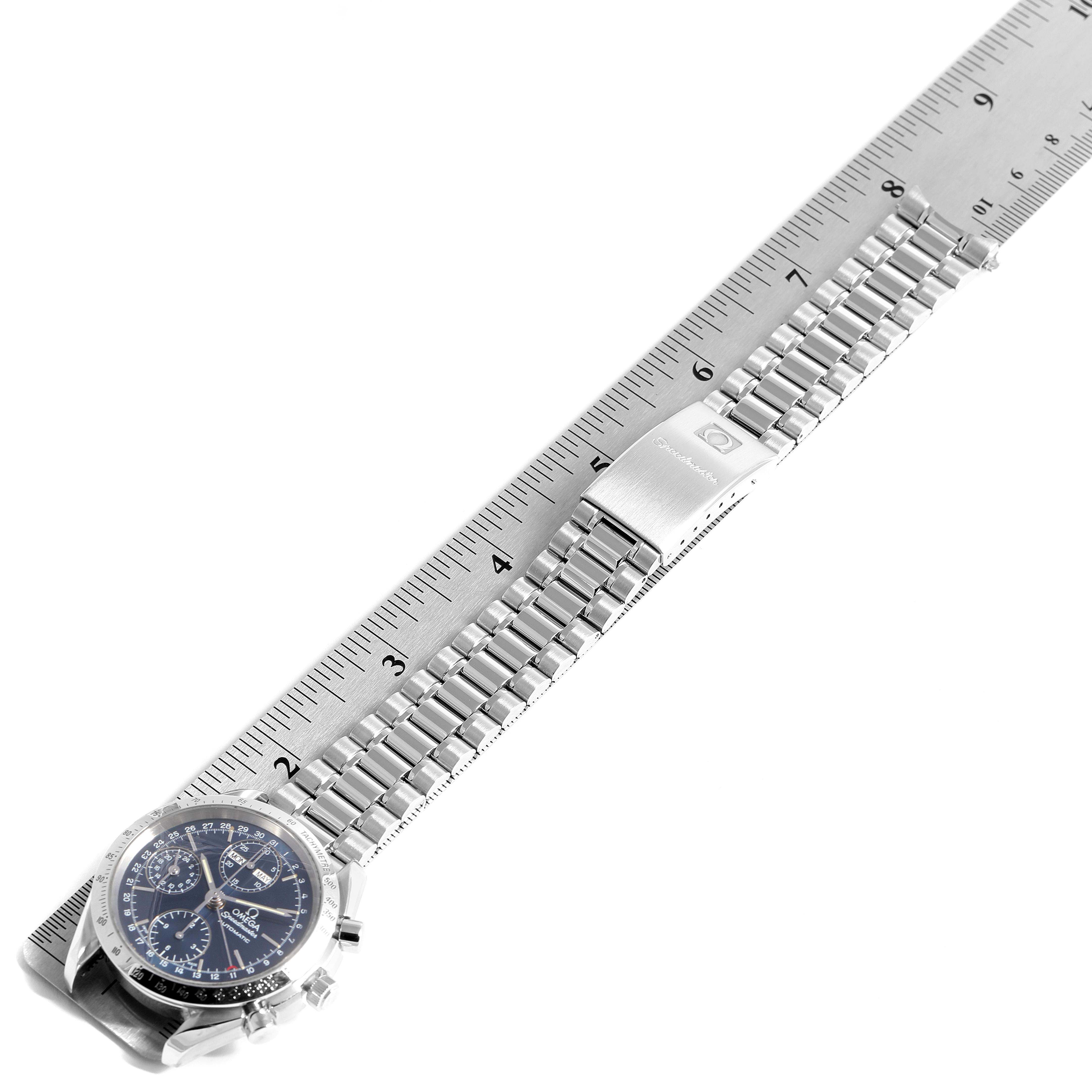 The image shows an Omega Speedmaster 3521.80.00 Men
s Stainless Steel Blue Dial 3521.80.00 Men
s Stainless Steel Blue Dial watch laid flat alongside a ruler, displaying the face, bracelet, and clasp.