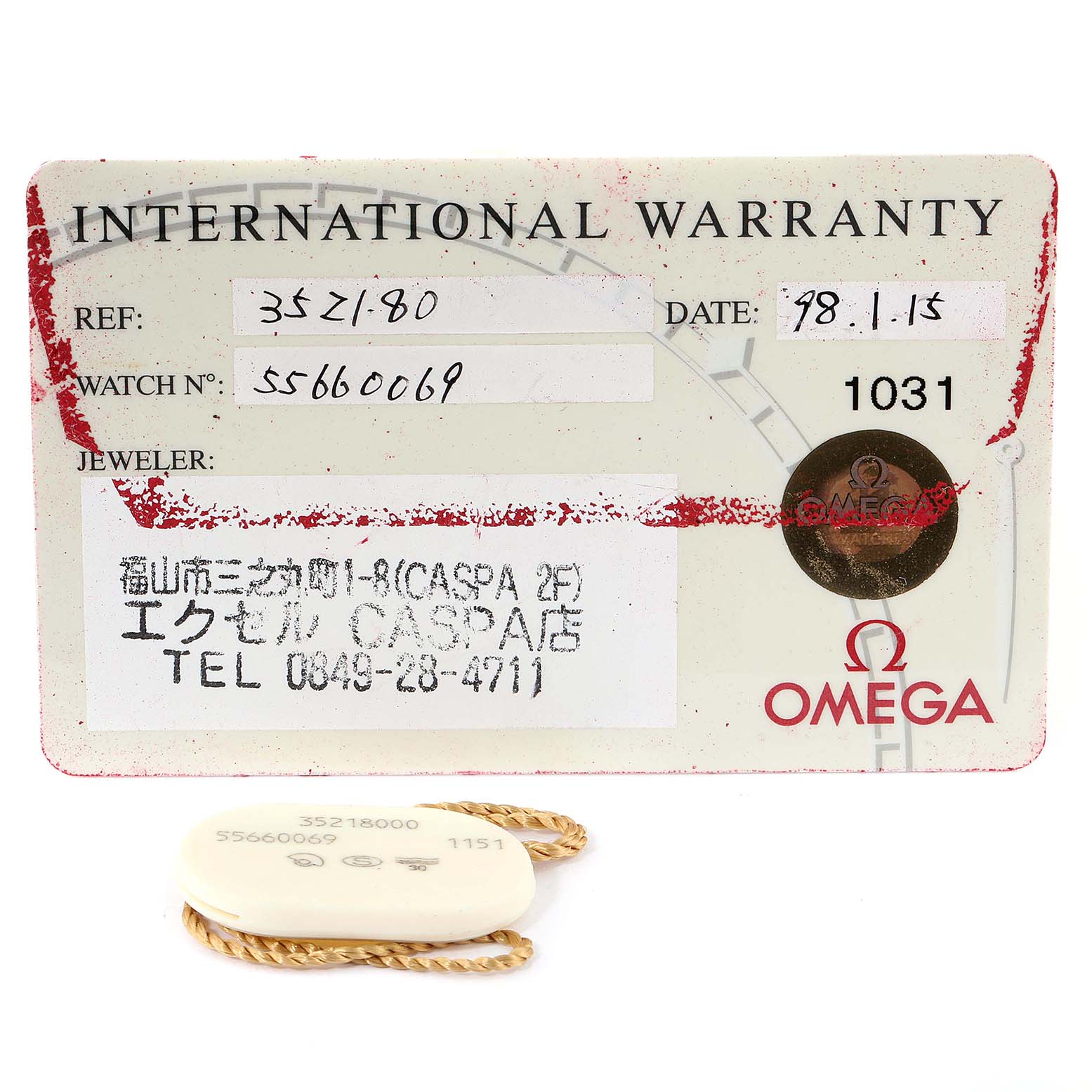 The image shows the international warranty card and a tag for an Omega Speedmaster 3521.80.00 Men
s Stainless Steel Blue Dial 3521.80.00 Men
s Stainless Steel Blue Dial watch.