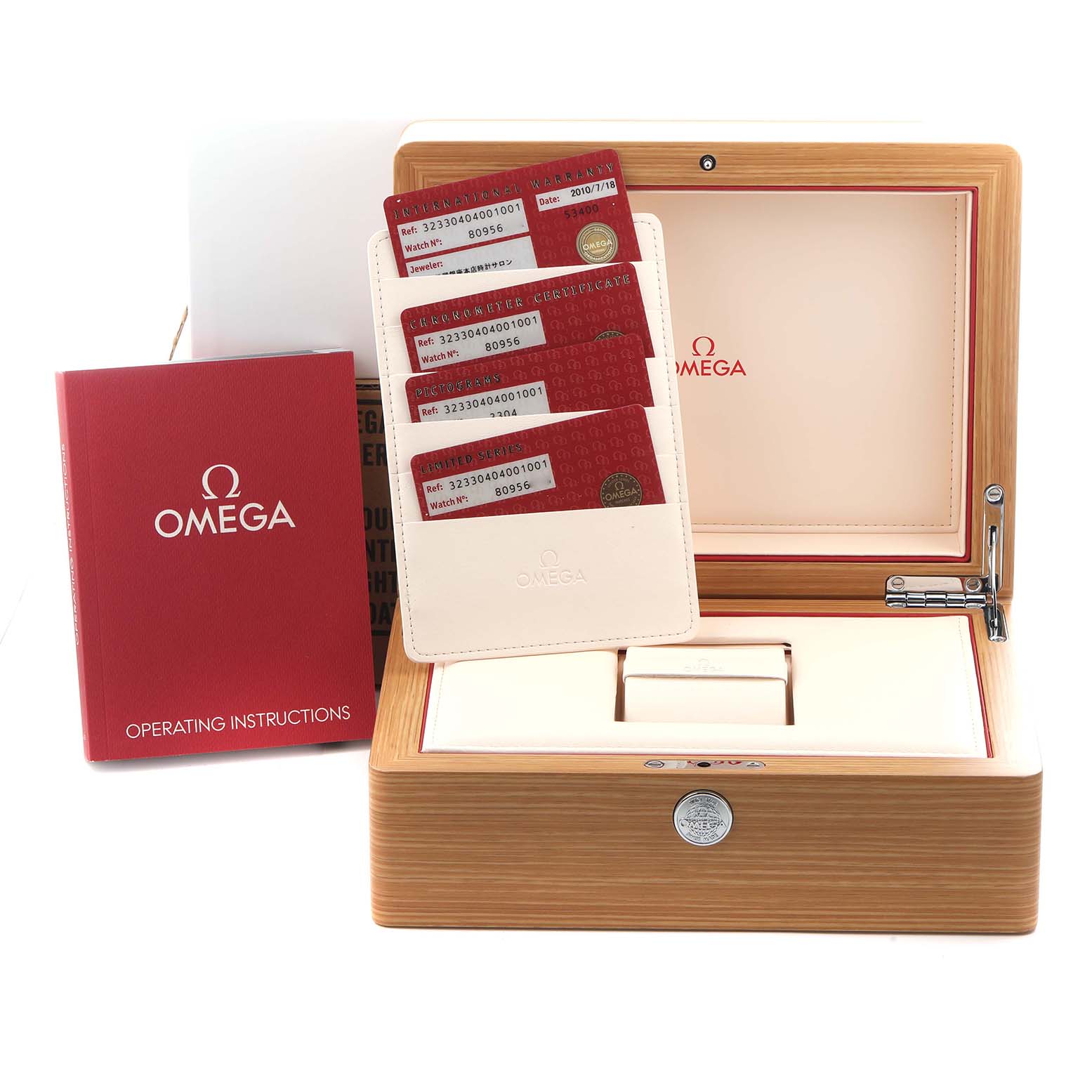 The image shows an Omega Speedmaster 323.30.40.40.01.001 Men
s Stainless Steel Black Dial 323.30.40.40.01.001 Men
s Stainless Steel Black Dial box with cards and an operating instructions booklet next to it.