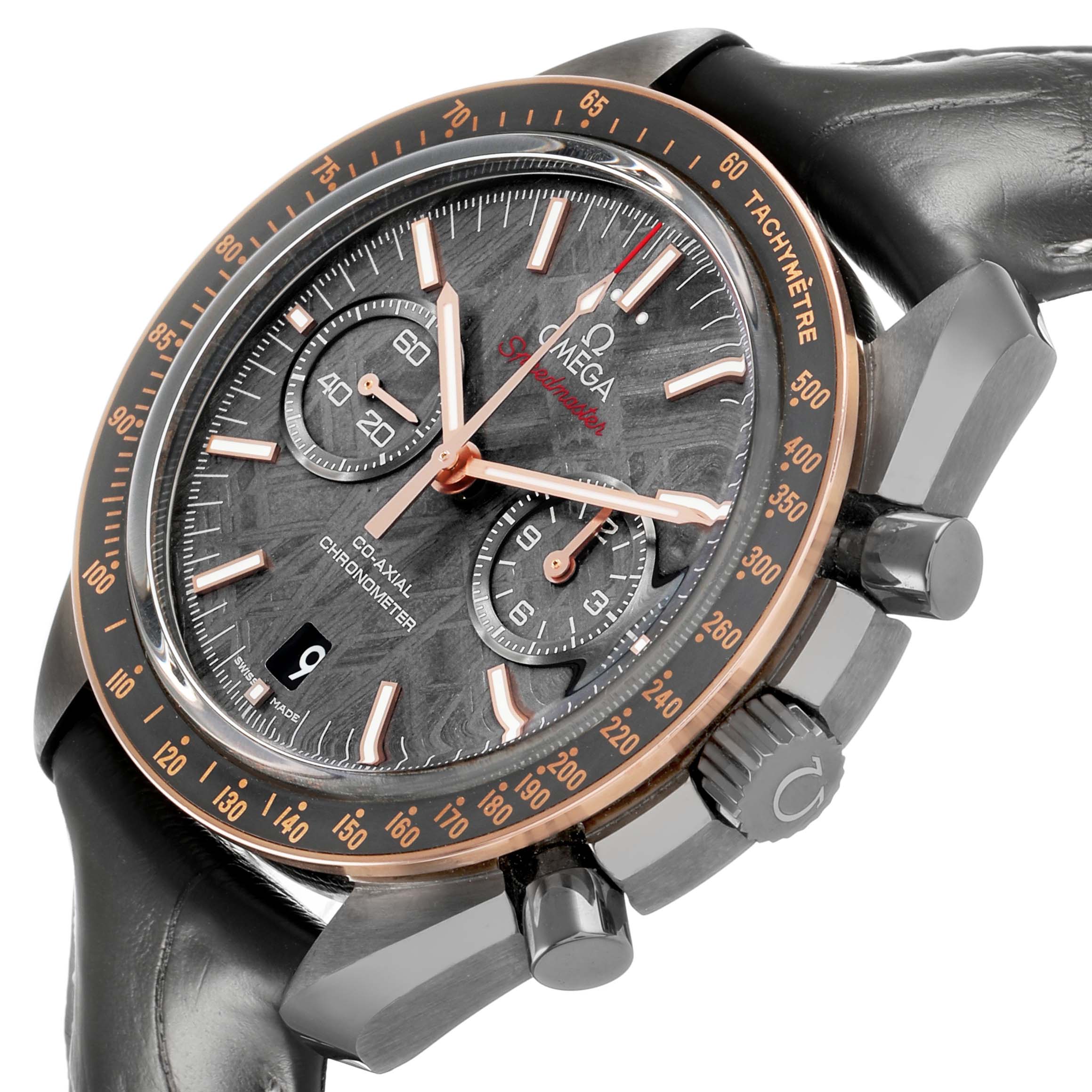 The Omega Speedmaster 311.63.44.51.99.001 Men's Ceramic Grey Dial watch is shown at an angle highlighting the face, bezel, crown, and chronograph pushers.