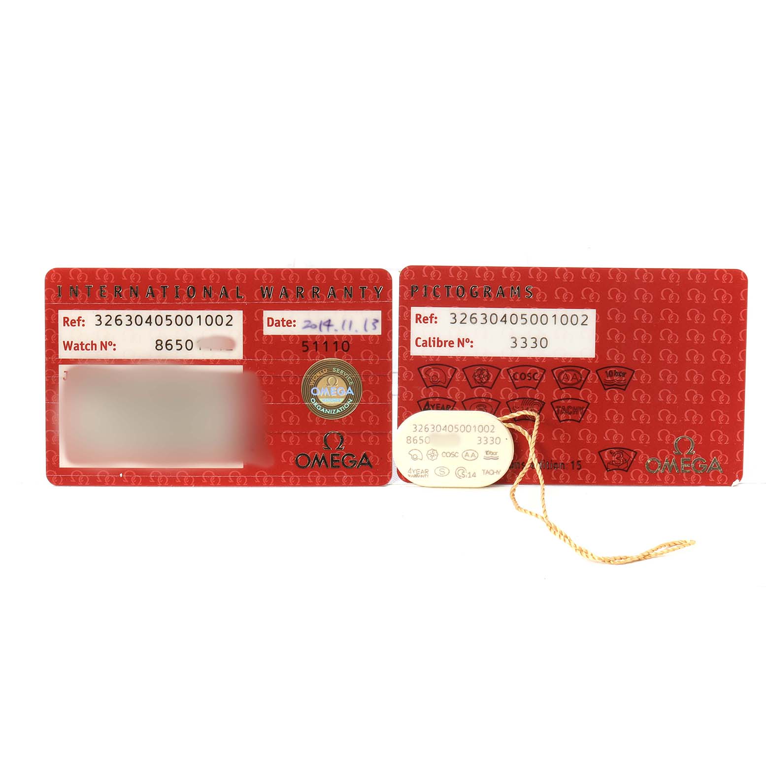 The image shows the international warranty and pictograms cards for the Omega Speedmaster 326.30.40.50.01.002 Men's Stainless Steel Black Dial watch.