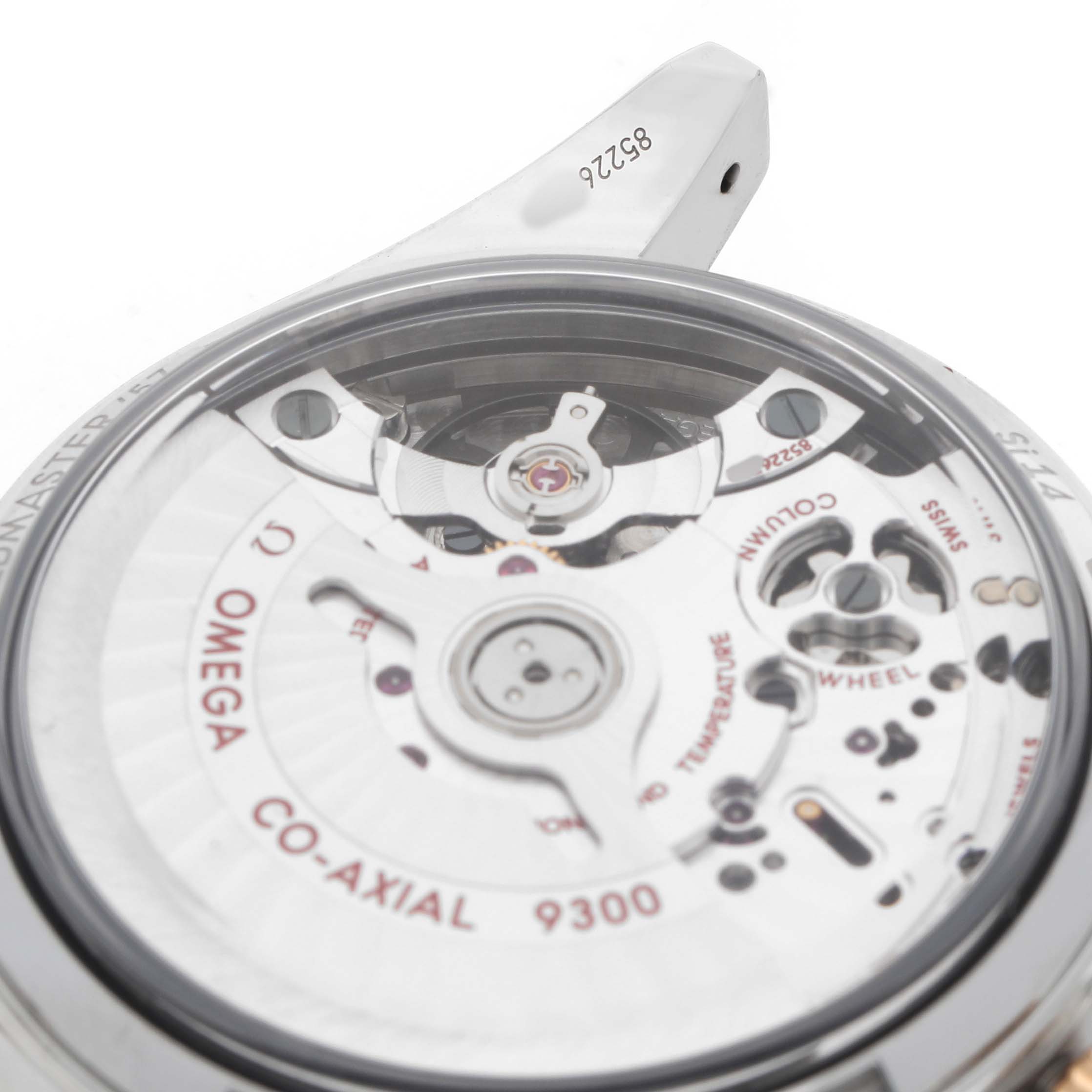 The image shows a close-up view of the back movement of an Omega Speedmaster 331.22.42.51.01.001 Men's Steel and Gold (two tone) Black Dial, focusing on the Co-Axial 9300 caliber.