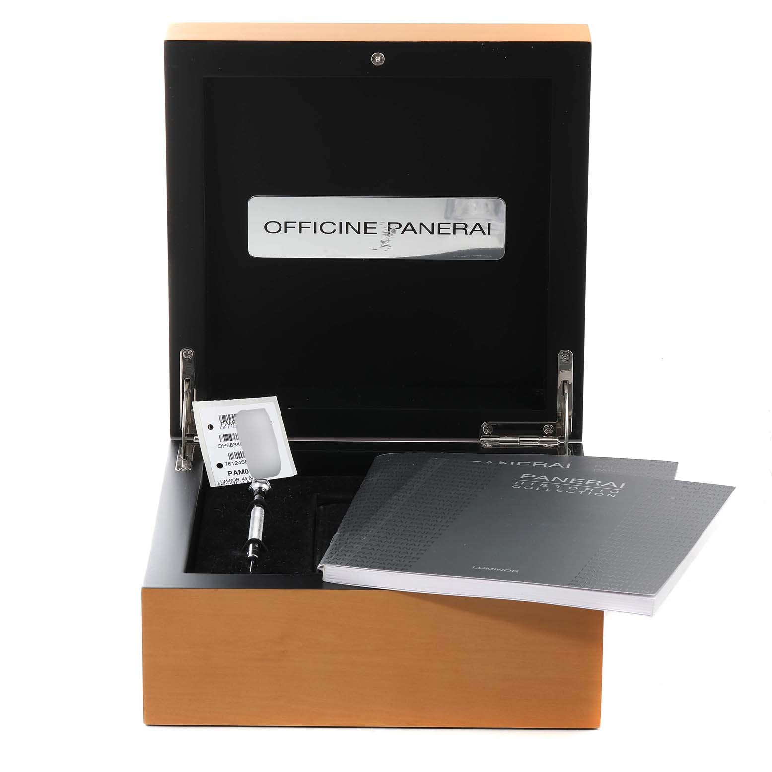 The image shows an open Panerai watch box for the Luminor model, containing a booklet and a tag.
