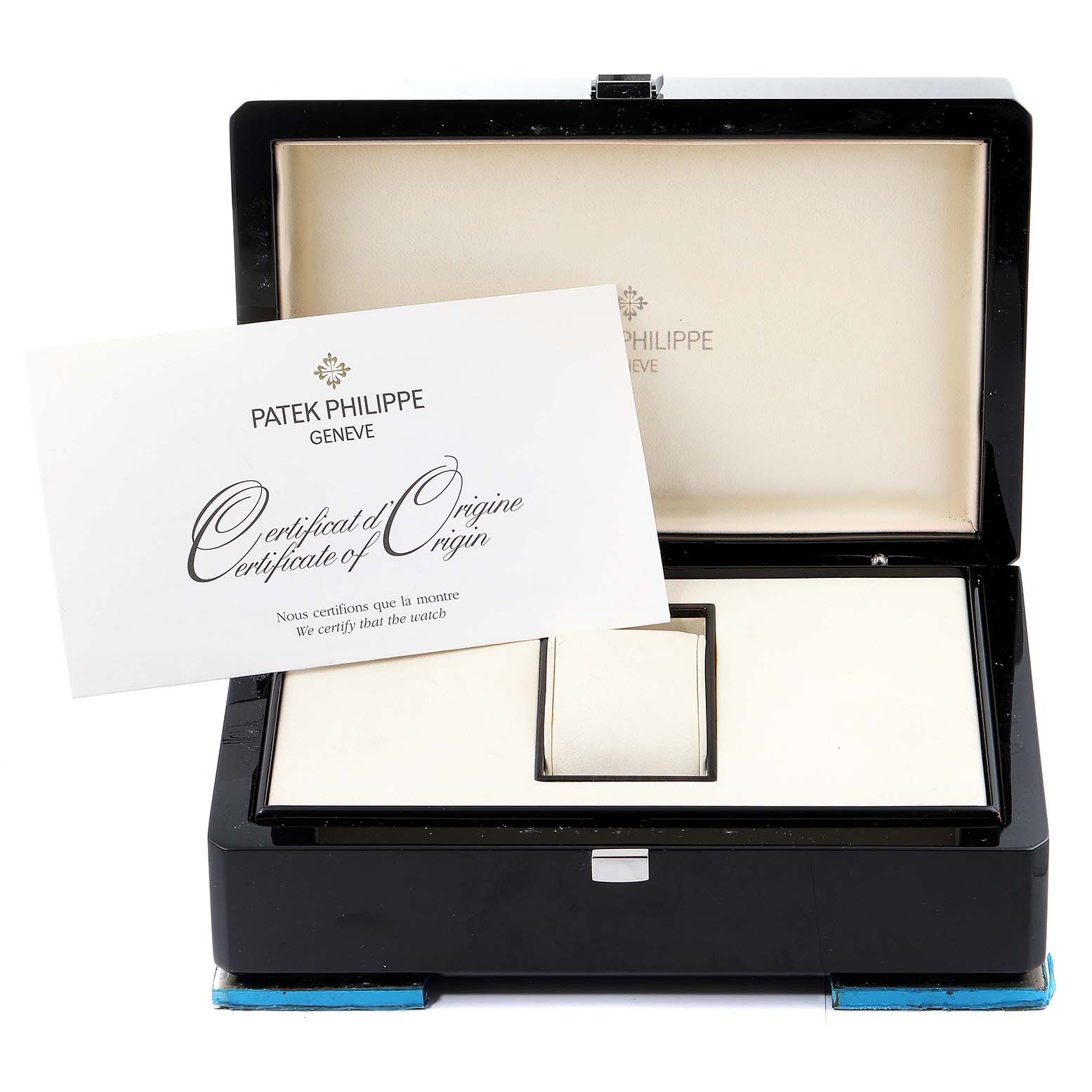 The image shows an angled view of the Patek Philippe Aquanaut 5167/1A-001 Men's Stainless Steel Black Dial 5167/1A-001 Men's Stainless Steel Black Dial watch box with a Certificate of Origin displayed inside.