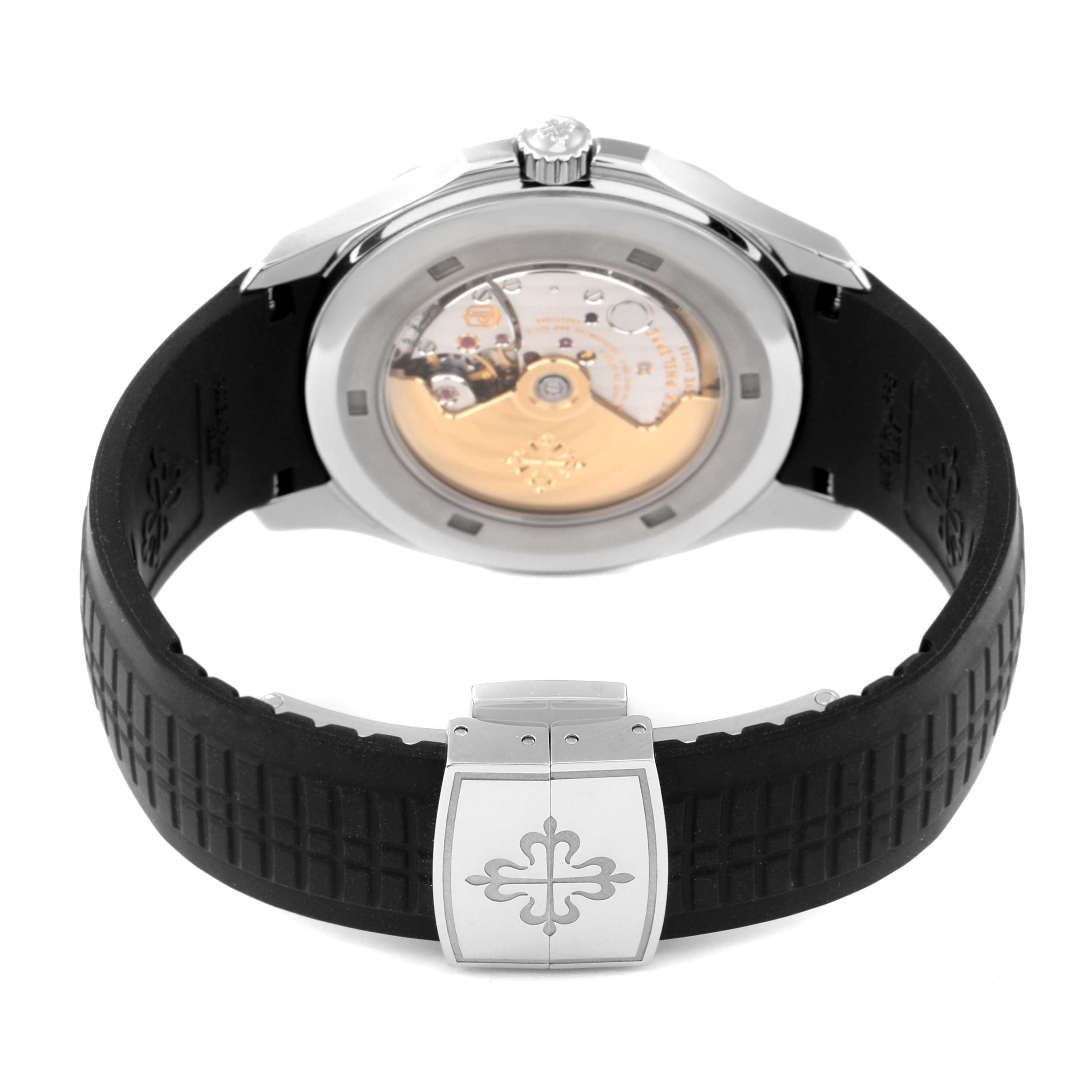 The image shows the back view of a Patek Philippe Aquanaut 5167A Men's Stainless Steel Black Dial 5167A Men's Stainless Steel Black Dial watch, highlighting the case back, movement, and rubber strap with a clasp.