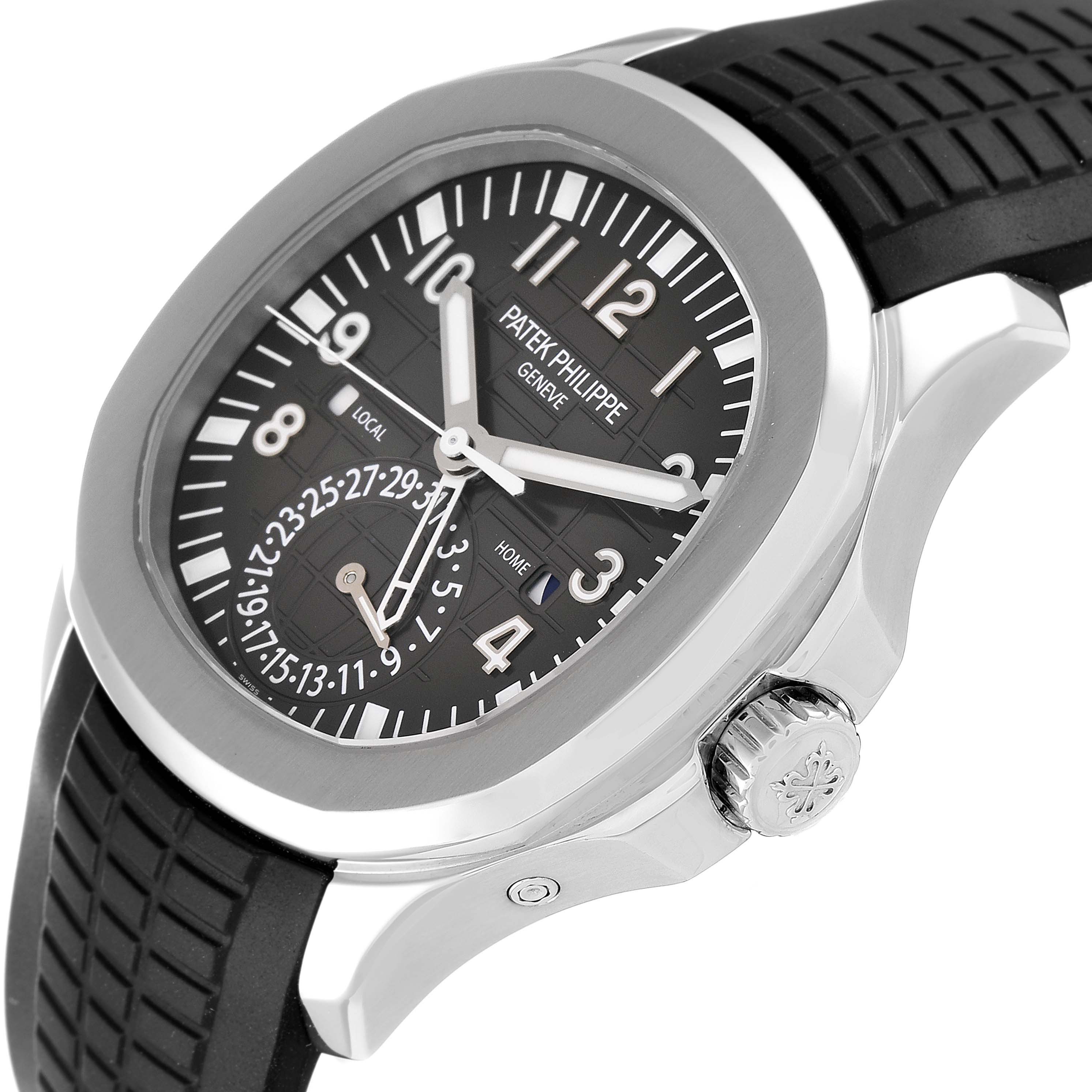 The image shows a close-up side angle of a Patek Philippe Aquanaut 5164A Men's Stainless Steel Black Dial 5164A Men's Stainless Steel Black Dial watch, highlighting its face, stainless steel case, and crown.
