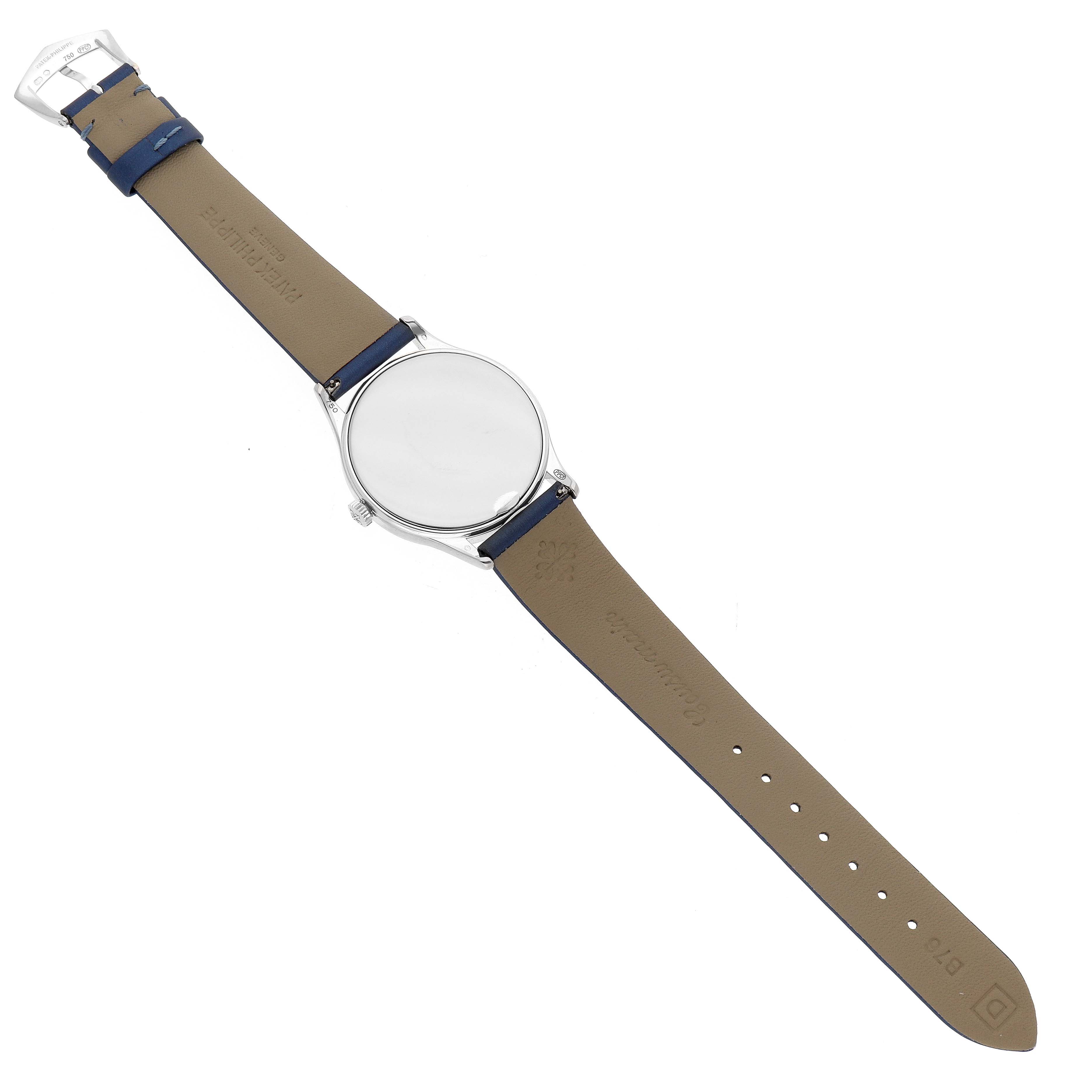 The Patek Philippe Calatrava 4896G Women's White Gold Blue Dial watch is shown from above, displaying the leather strap, case back, and buckle.