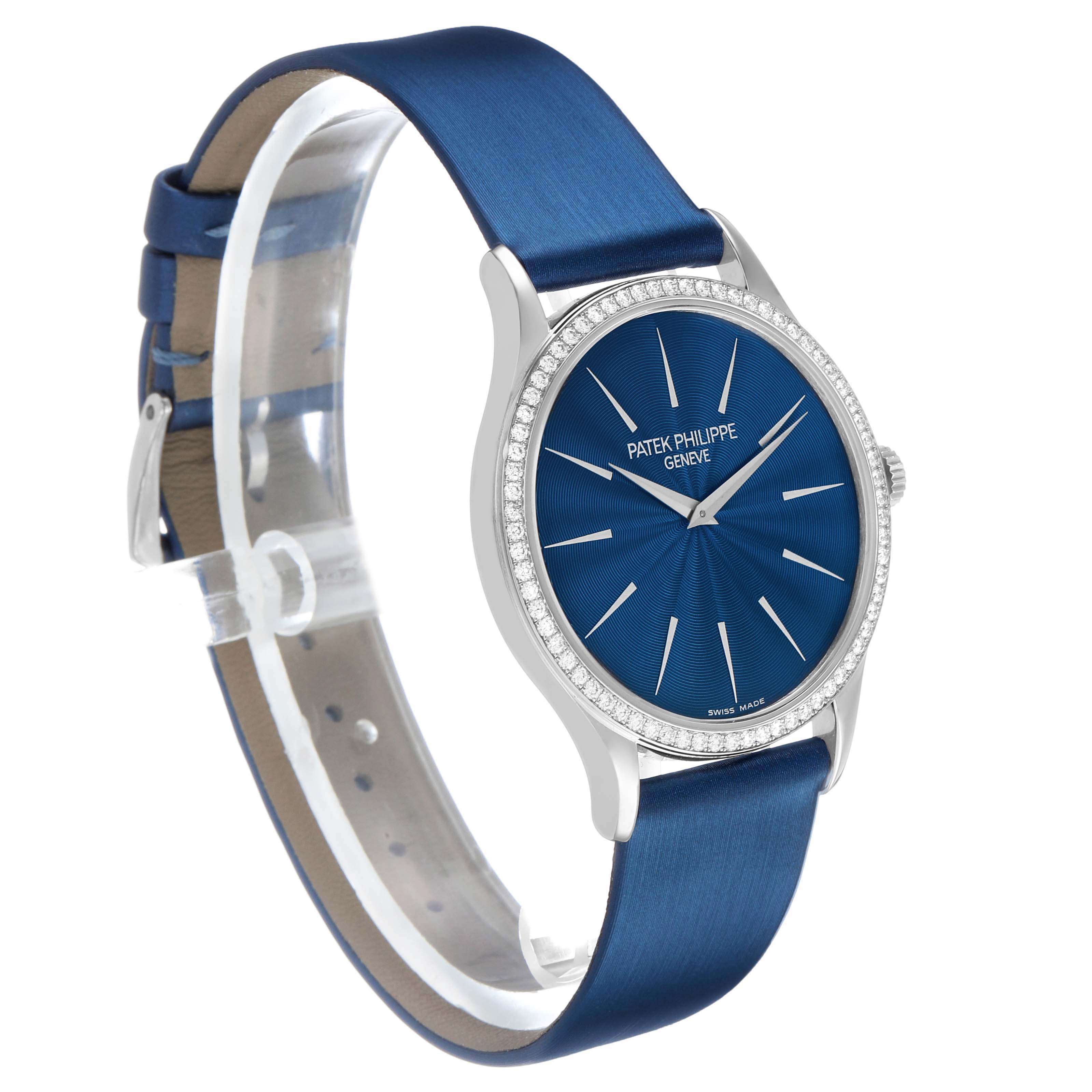 The Patek Philippe Calatrava 4896G Women's White Gold Blue Dial watch is shown at a slight angle, highlighting the blue dial, bezel, and leather strap.