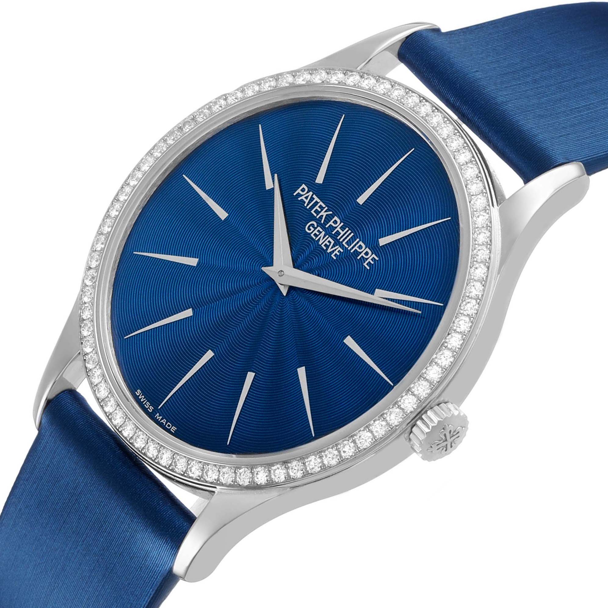 The Patek Philippe Calatrava 4896G Women's White Gold Blue Dial watch is shown from a top angle, highlighting the blue dial, diamond bezel, and crown.