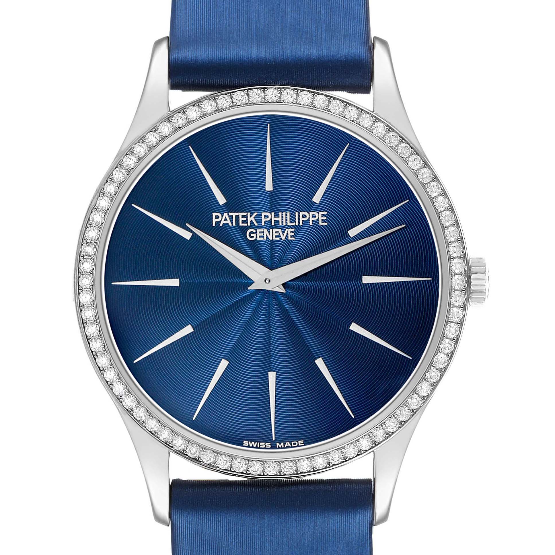 The image shows a front view of a Patek Philippe Calatrava 4896G Women's White Gold Blue Dial watch with a blue dial, diamond bezel, and hour markers.