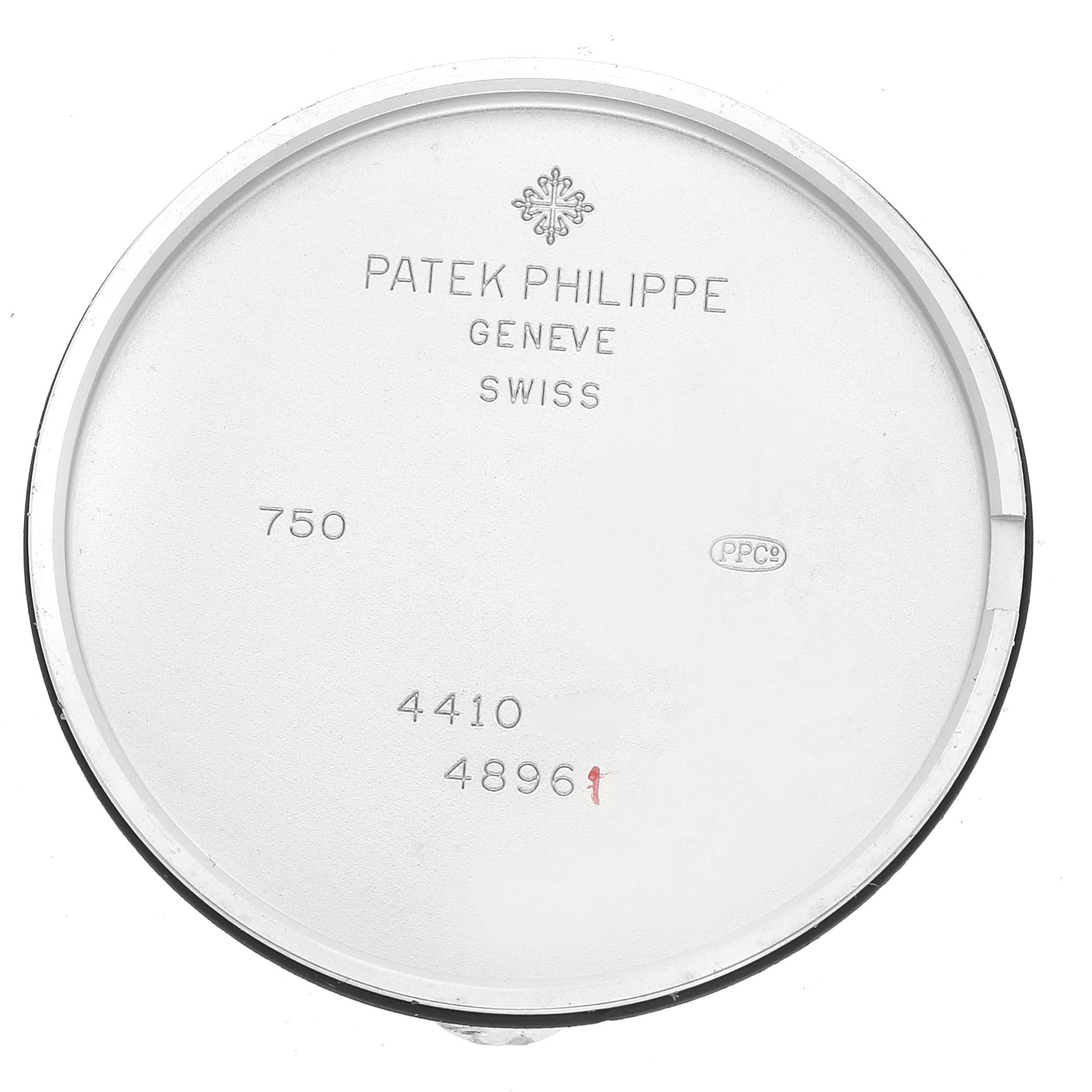 The image shows the inner case back of a Calatrava model by Patek Philippe, displaying reference numbers and manufacturer markings.