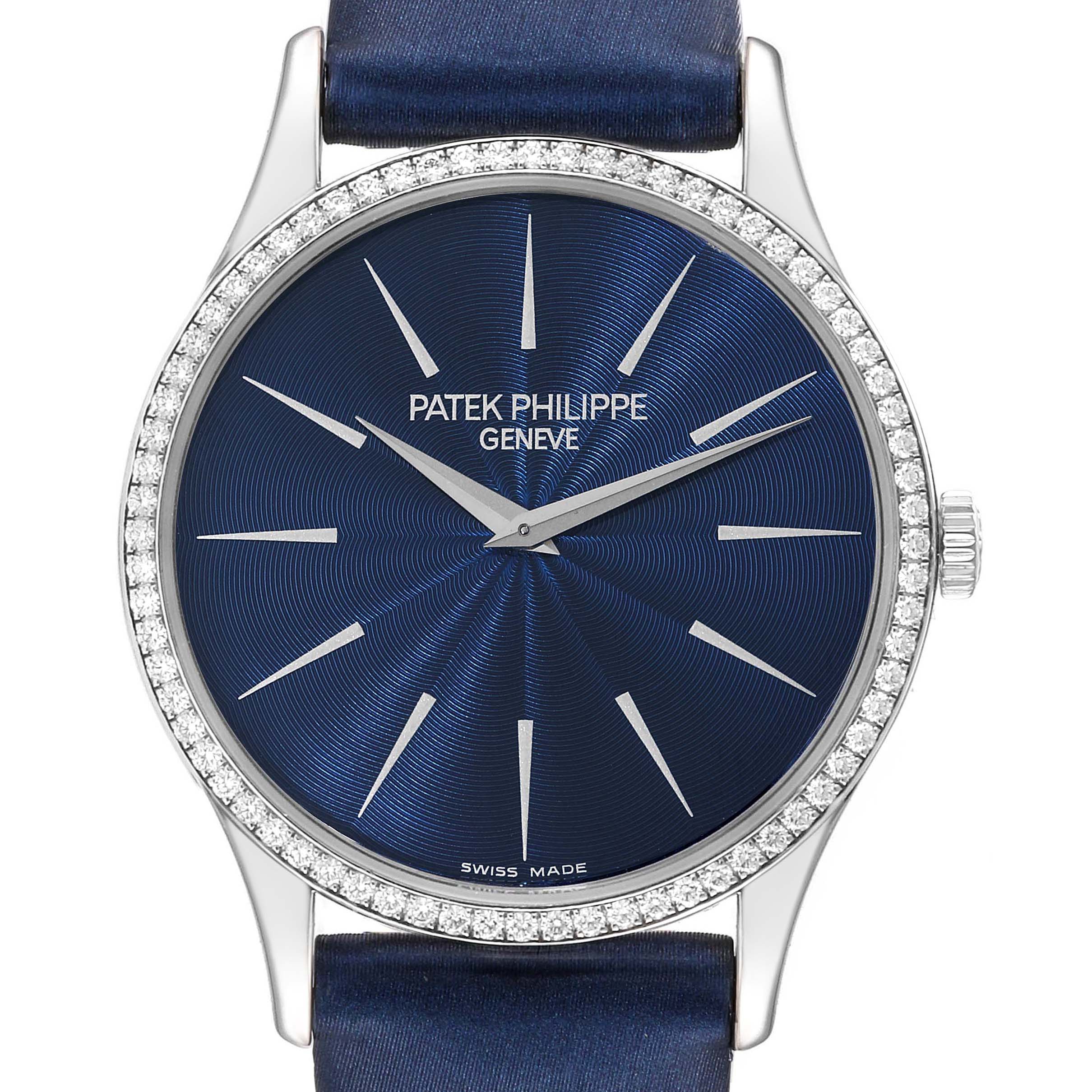This image shows a front angle of the Patek Philippe Calatrava 4896G Women's White Gold Blue Dial 4896G Women's White Gold Blue Dial watch featuring a blue dial and a diamond-studded bezel.