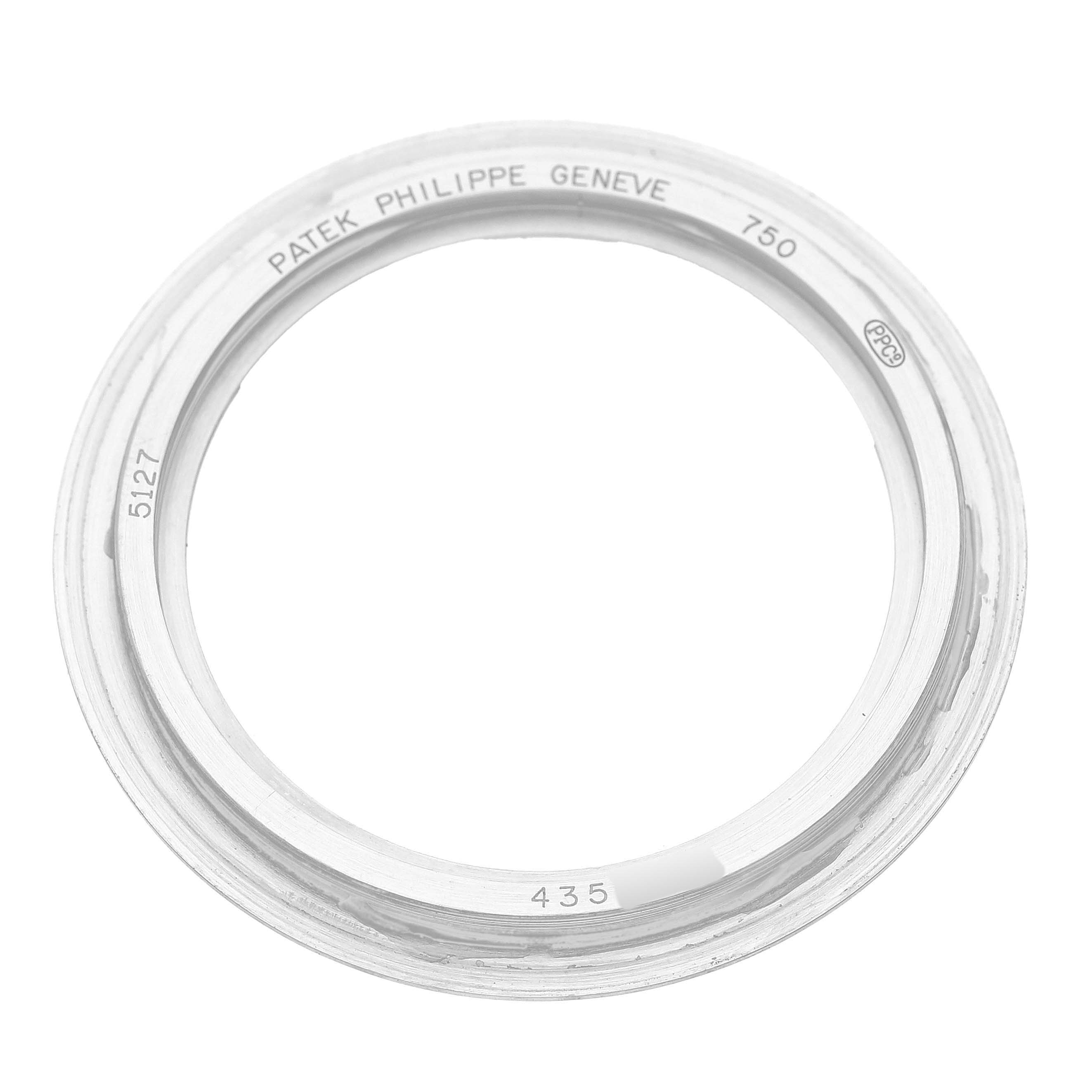 The image shows a bezel from a Patek Philippe Calatrava 5127G-001 Men's White Gold White Dial watch, viewed from the side with engravings visible.
