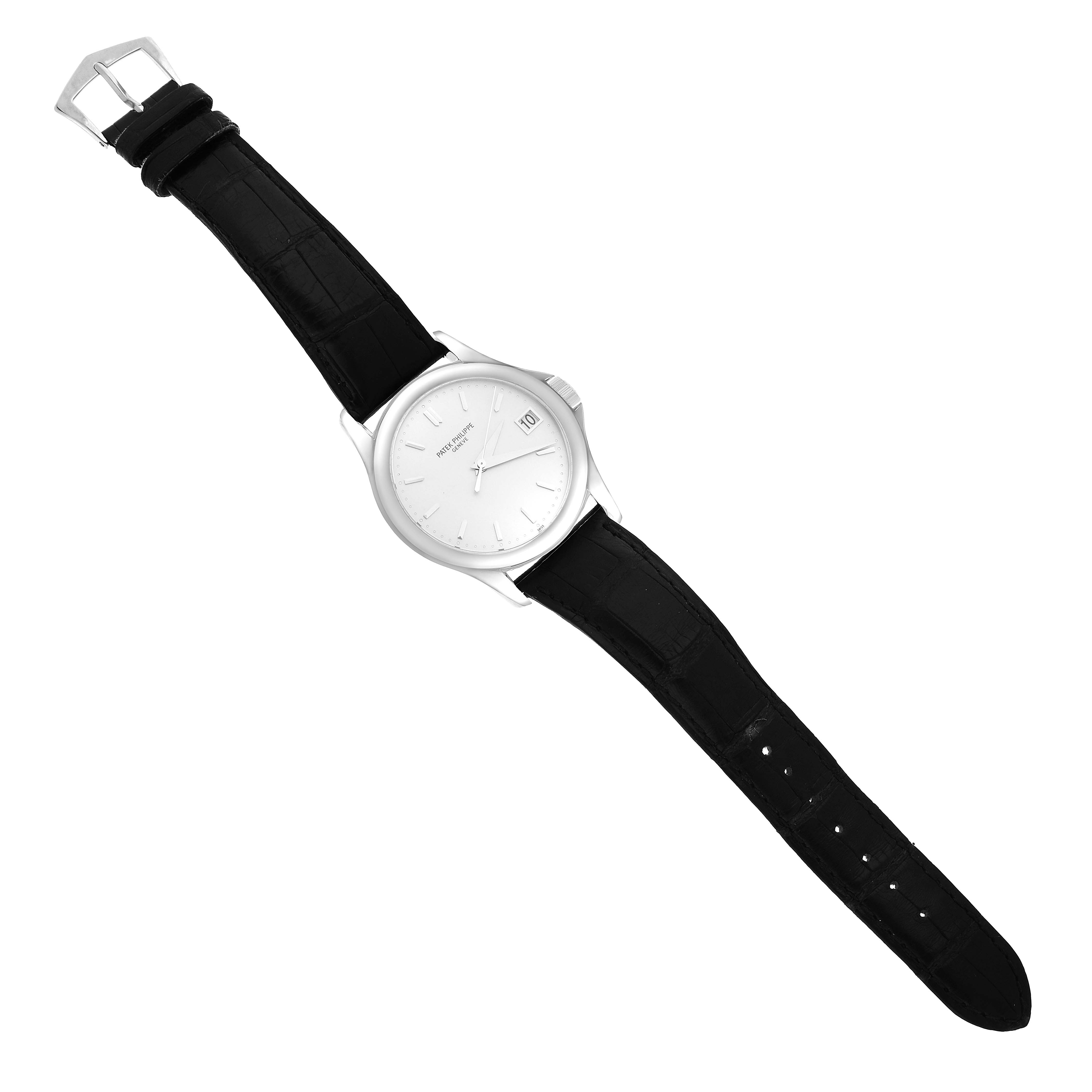 The Patek Philippe Calatrava 5127G-001 Men's White Gold White Dial watch is shown from above, displaying the dial, case, and black leather strap.
