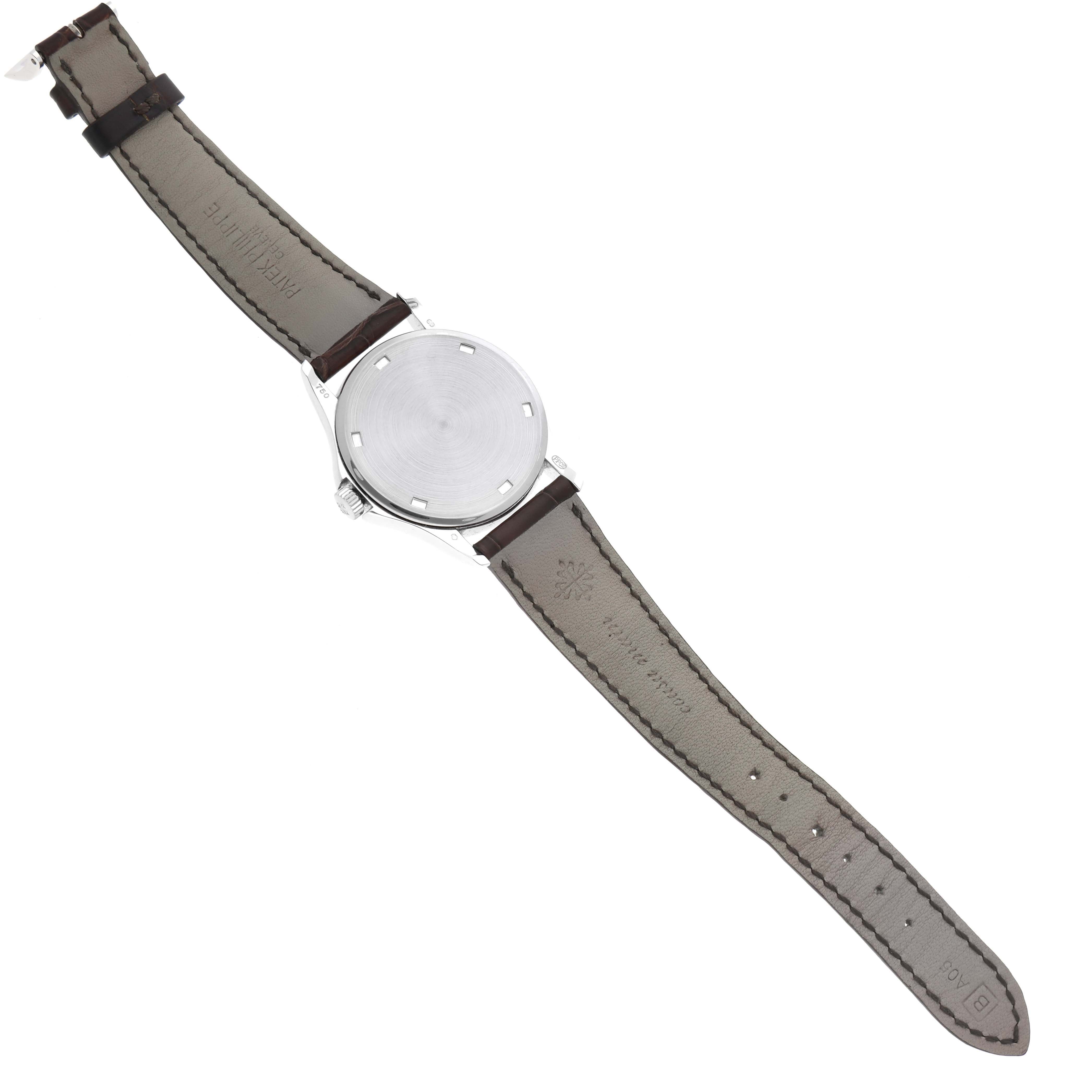 This image displays the back view of a Patek Philippe Calatrava 5115G Men's White Gold White Dial 5115G Men's White Gold White Dial watch, highlighting its case back and leather strap.