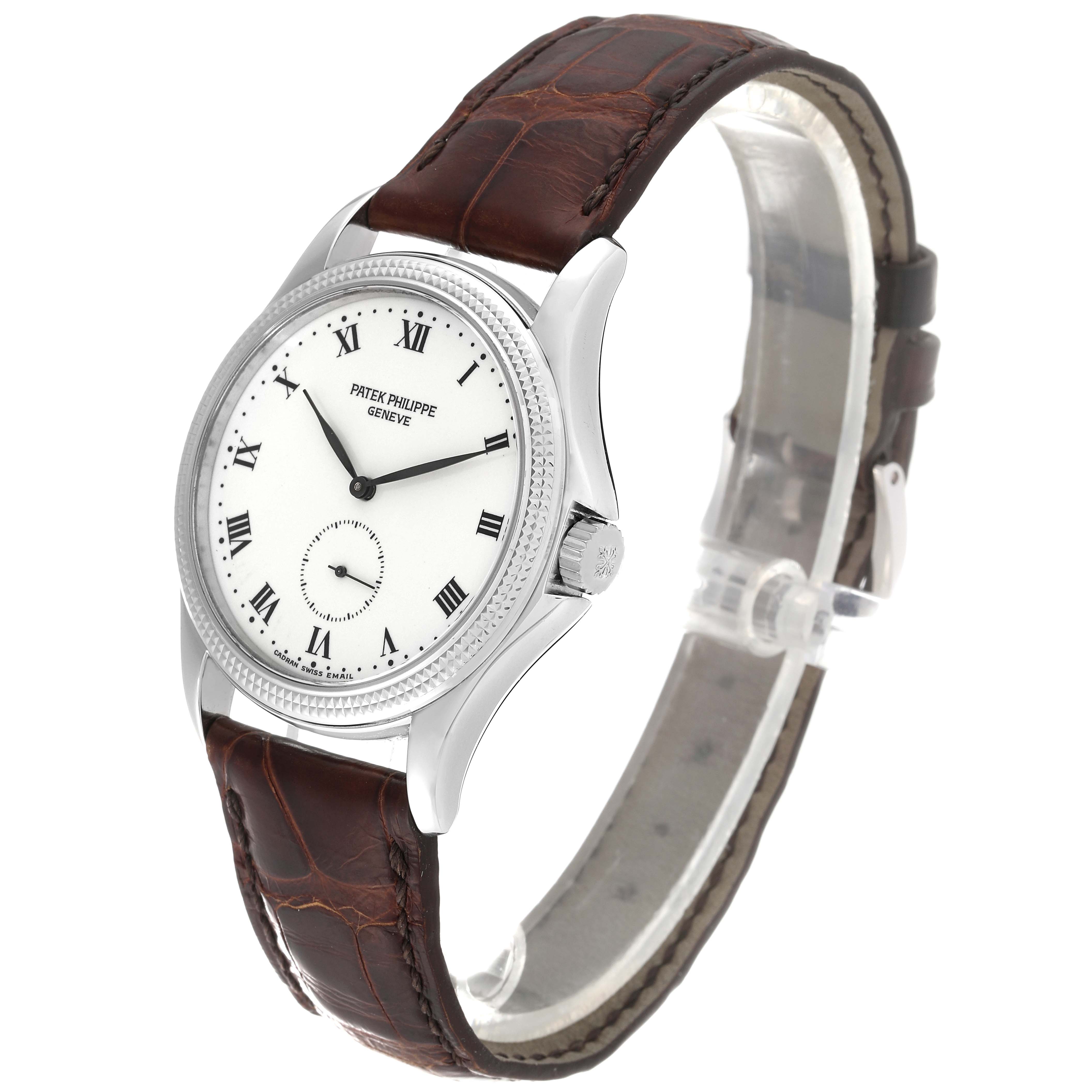 This image shows a side-angle view of the Patek Philippe Calatrava 5115G Men's White Gold White Dial 5115G Men's White Gold White Dial watch with a brown leather strap and white dial featuring Roman numerals.