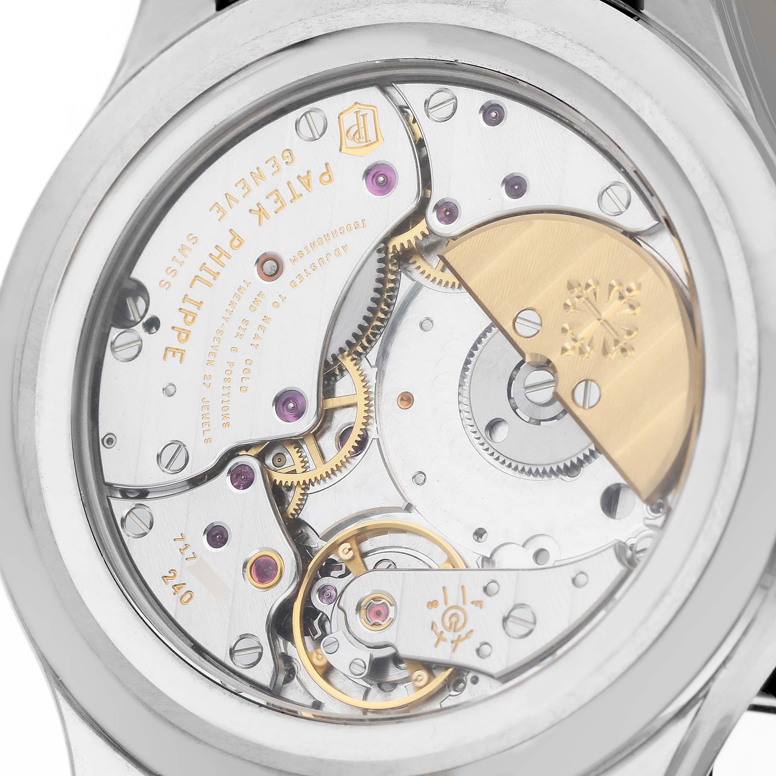 The image shows the back view of the Patek Philippe Complications 5327G Men's White Gold Blue Dial model, highlighting its intricate movement.