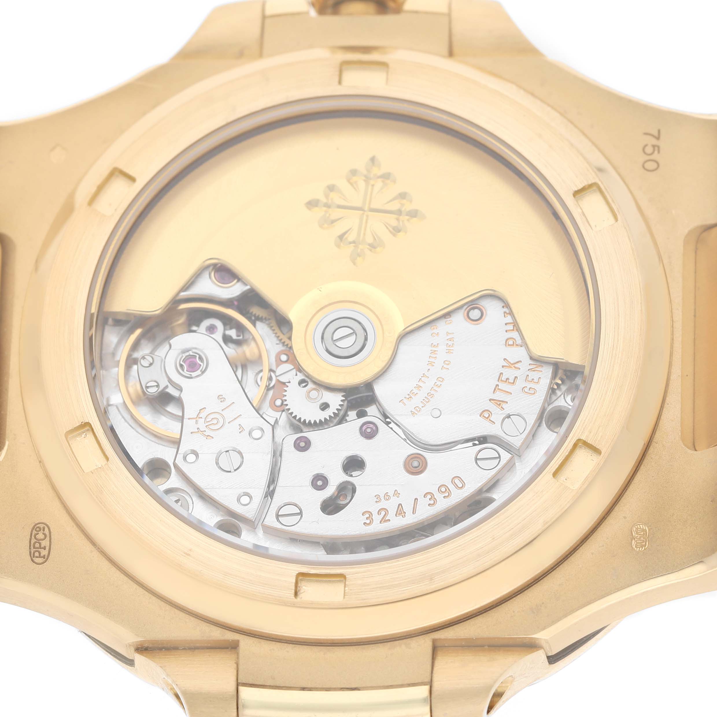 The image shows the back of a Patek Philippe Nautilus 5711J Men's Yellow Gold Silver Dial, focusing on its exposed movement and intricate internal mechanisms.