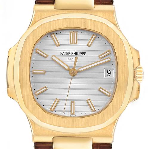 The Patek Philippe Nautilus 5711J Men's Yellow Gold Silver Dial watch is shown from the front, highlighting the dial, bezel, and gold case with the date visible at 3 o'clock.