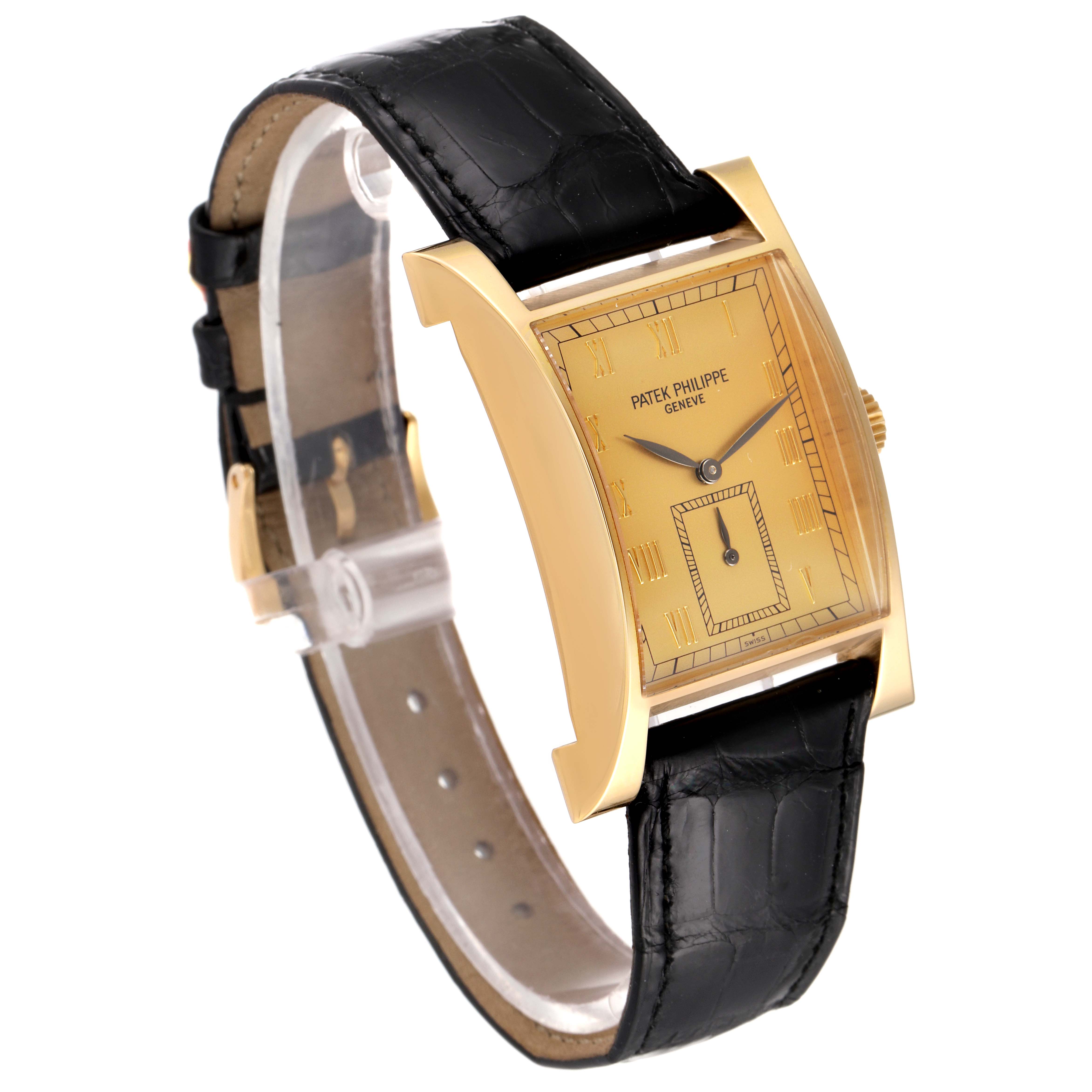 The Patek Philippe Pagoda 5500 Men's Yellow Gold Champagne Dial 5500 Men's Yellow Gold Champagne Dial Yellow Gold Limited Edition Mens Watch 5500J is shown at an angle displaying the face, case, and black leather strap.