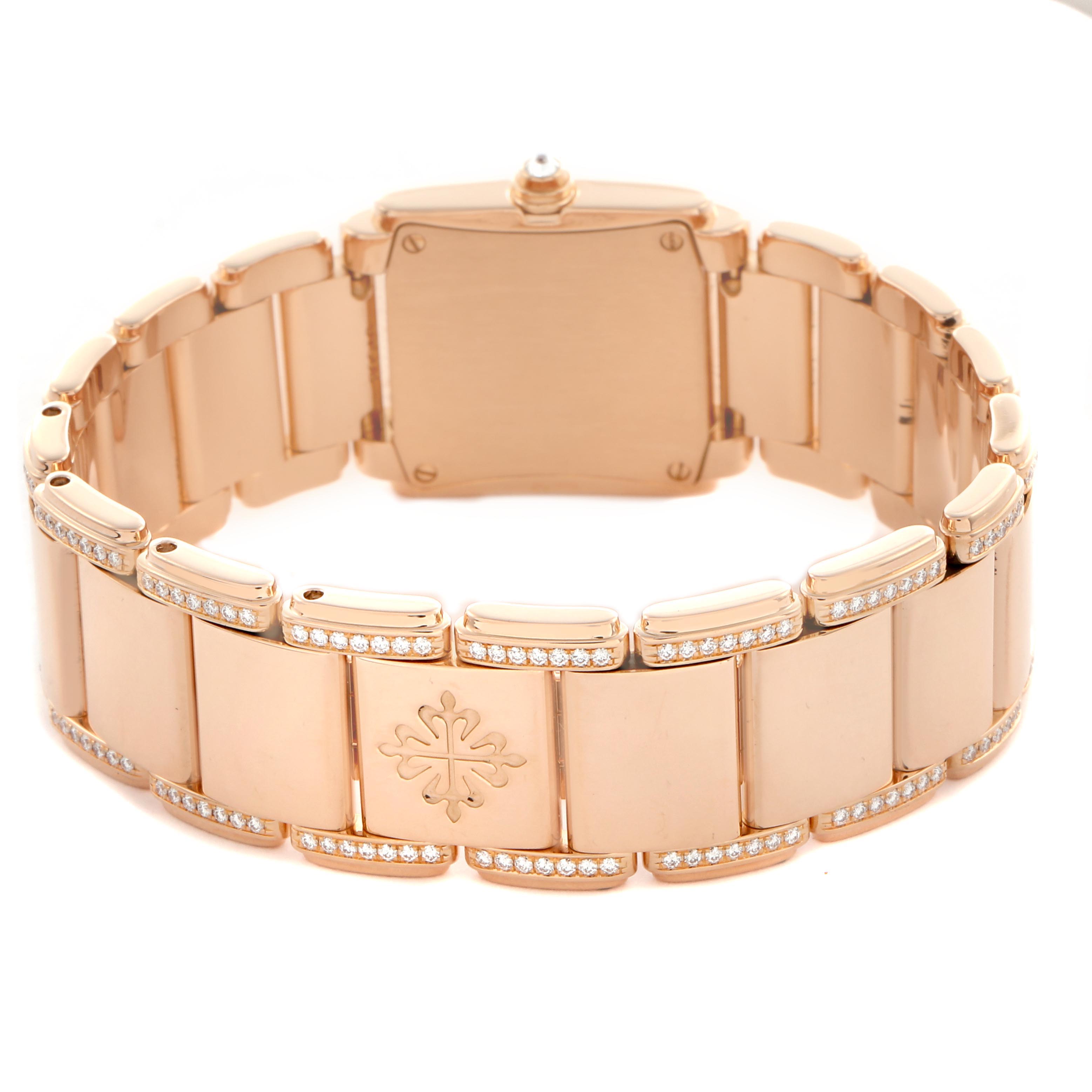 The image shows the back and bracelet of a Patek Philippe Twenty-4 4908/30R Women
s Rose Gold Brown Dial 4908/30R Women
s Rose Gold Brown Dial watch, featuring a rose gold finish with diamond accents.